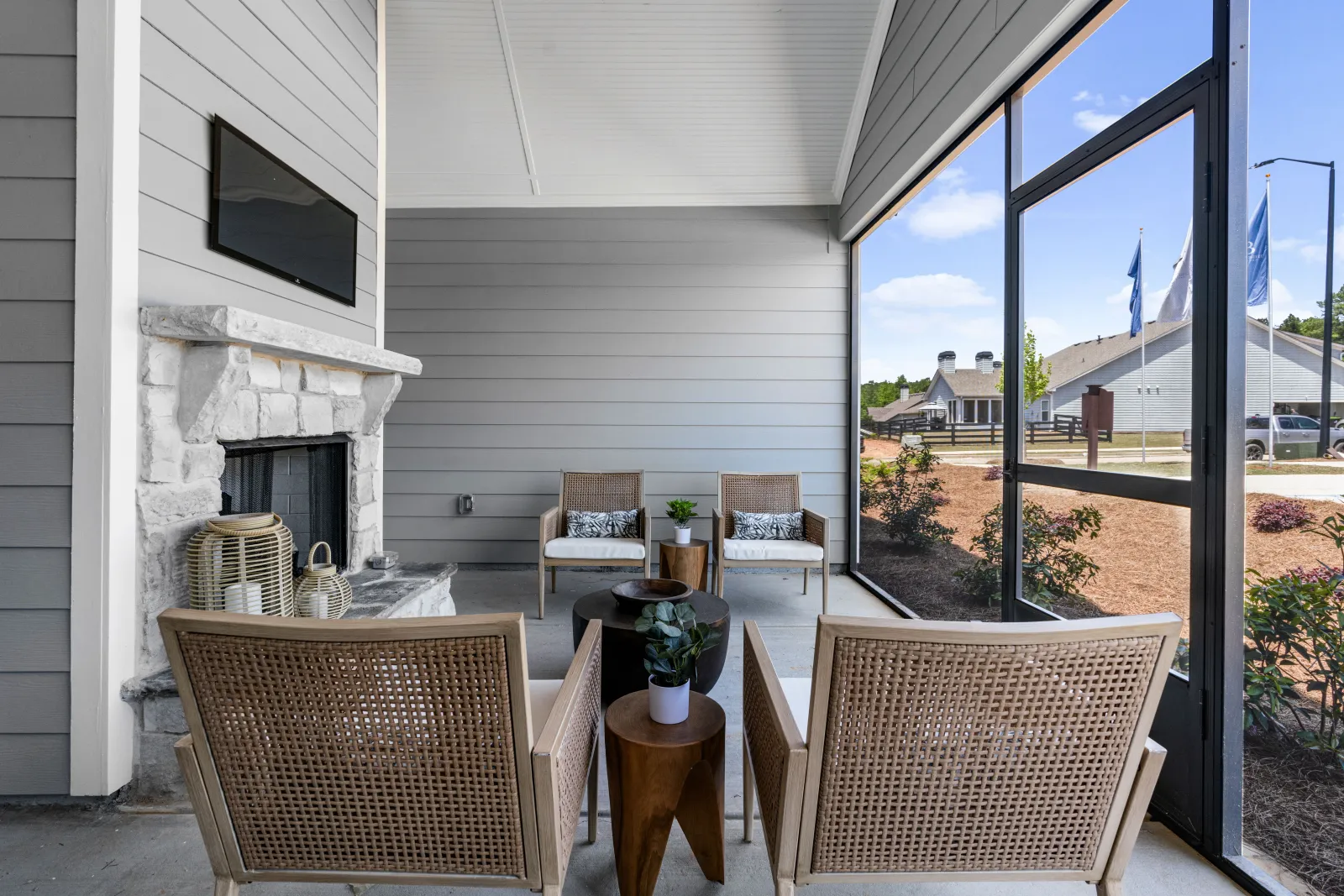 a patio with a table and chairs