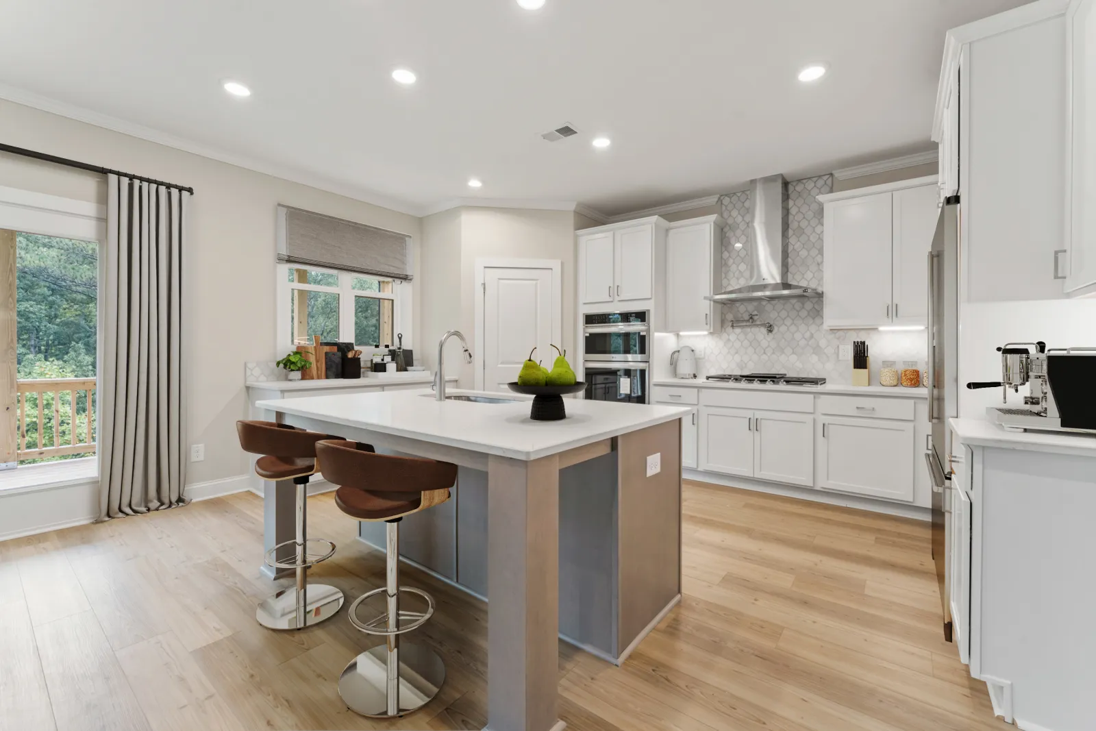 a kitchen with white cabinets