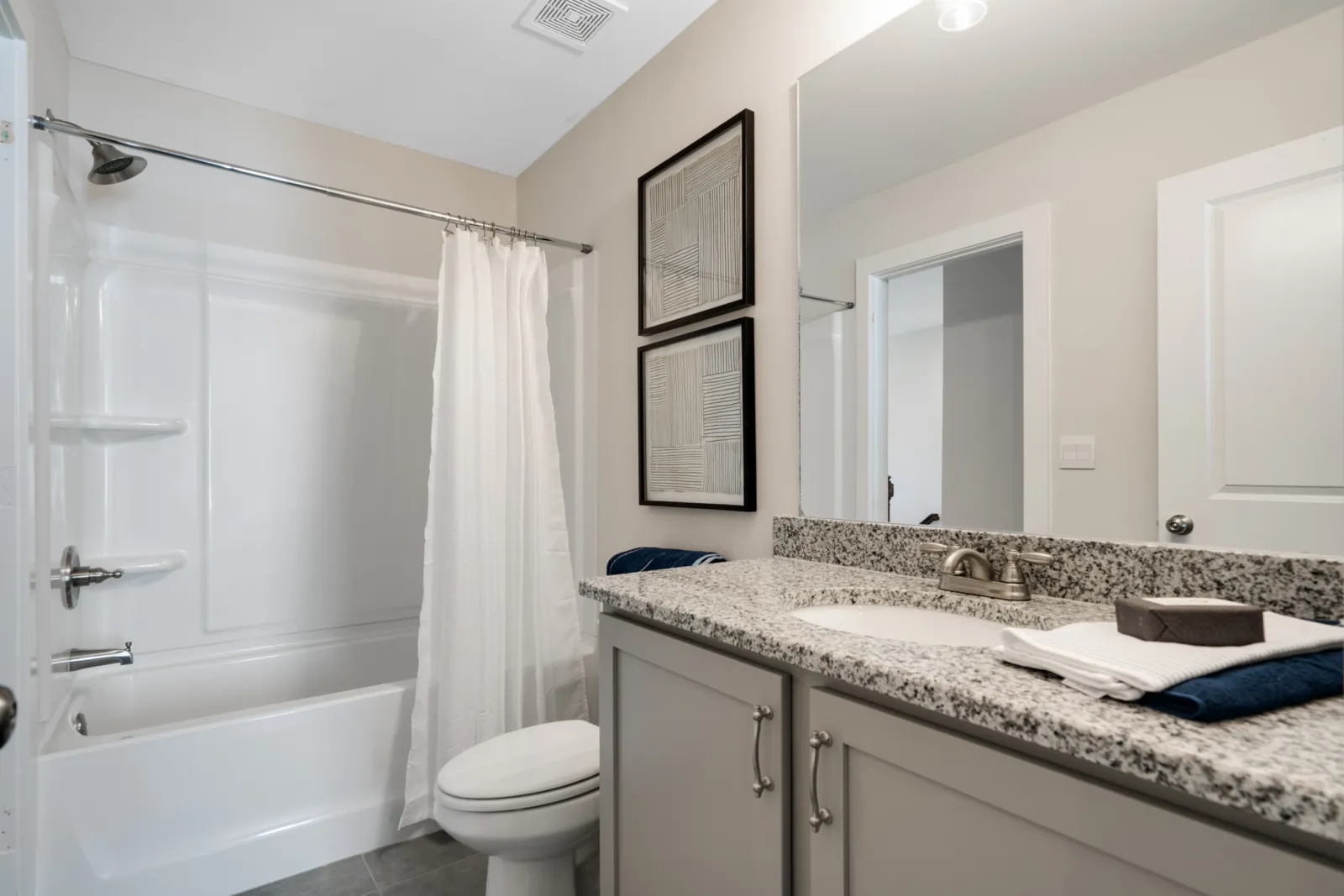 a bathroom with a marble countertop