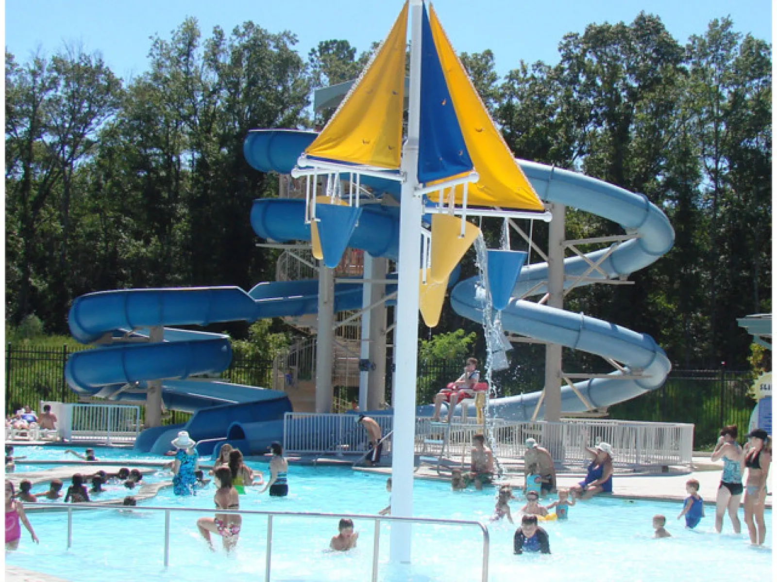 a water park with people and slides