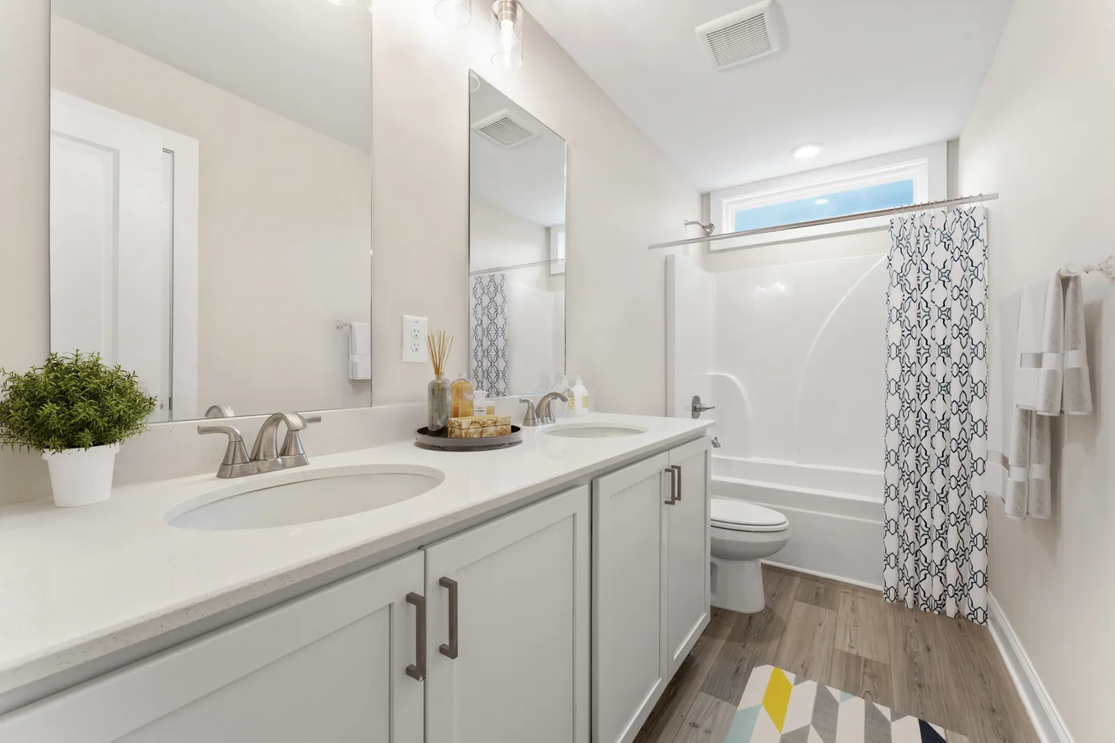 a bathroom with a tub sink and toilet