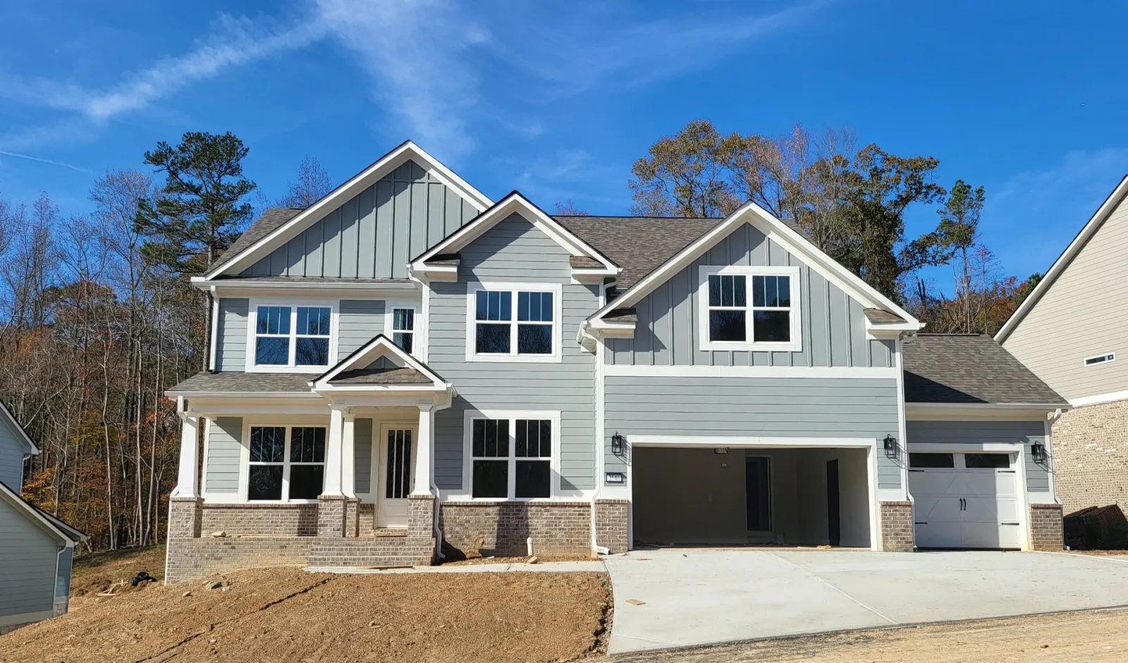 a white house with a garage