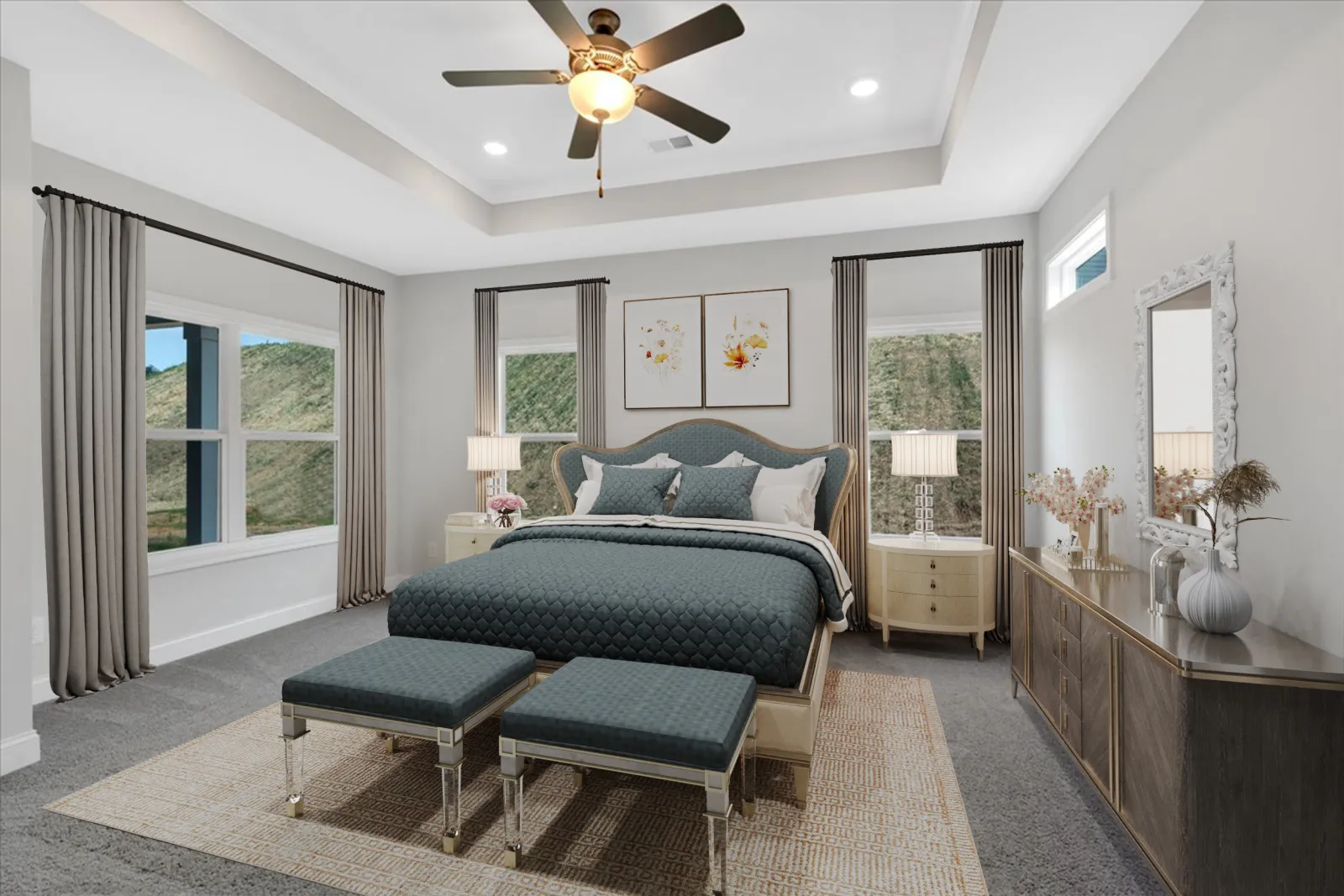 Modern bedroom with blue upholstered bed, matching benches, beige curtains, nightstands, and ceiling fan.