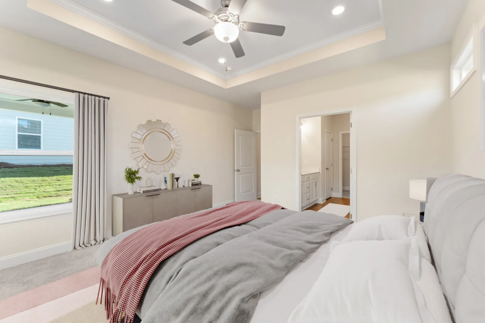 a bedroom with a large window