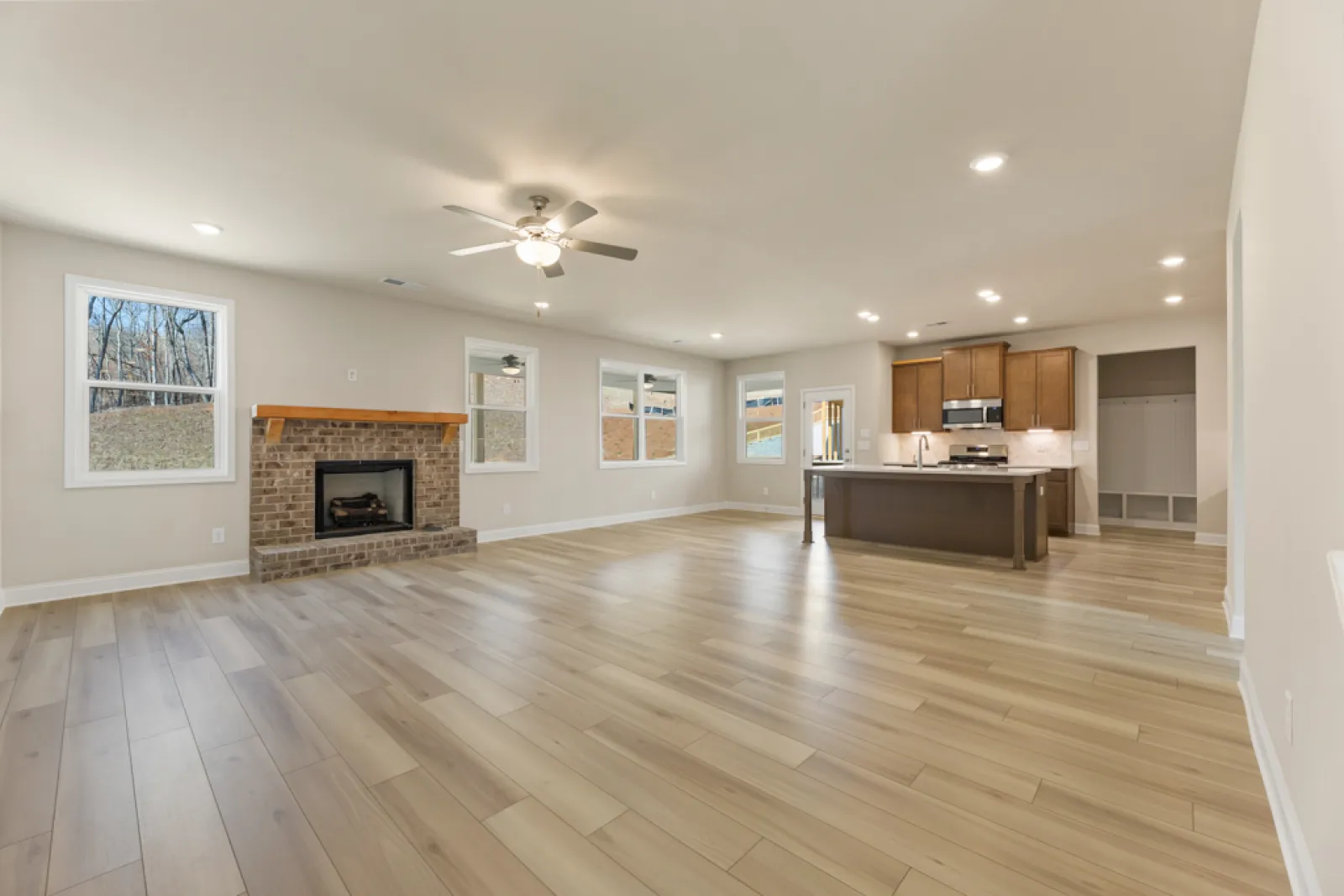 a large kitchen with a fireplace