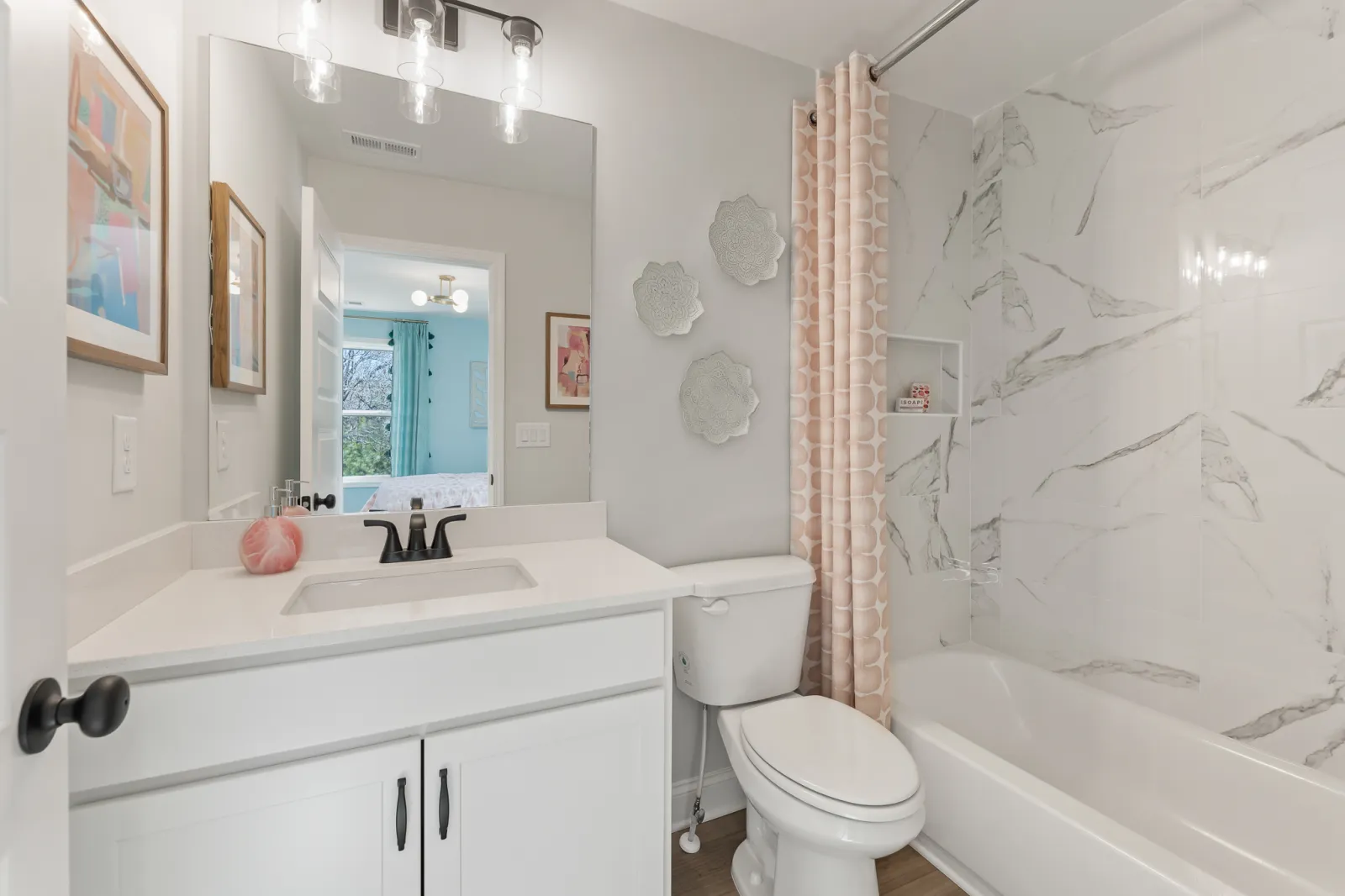 a bathroom with a tub toilet and sink