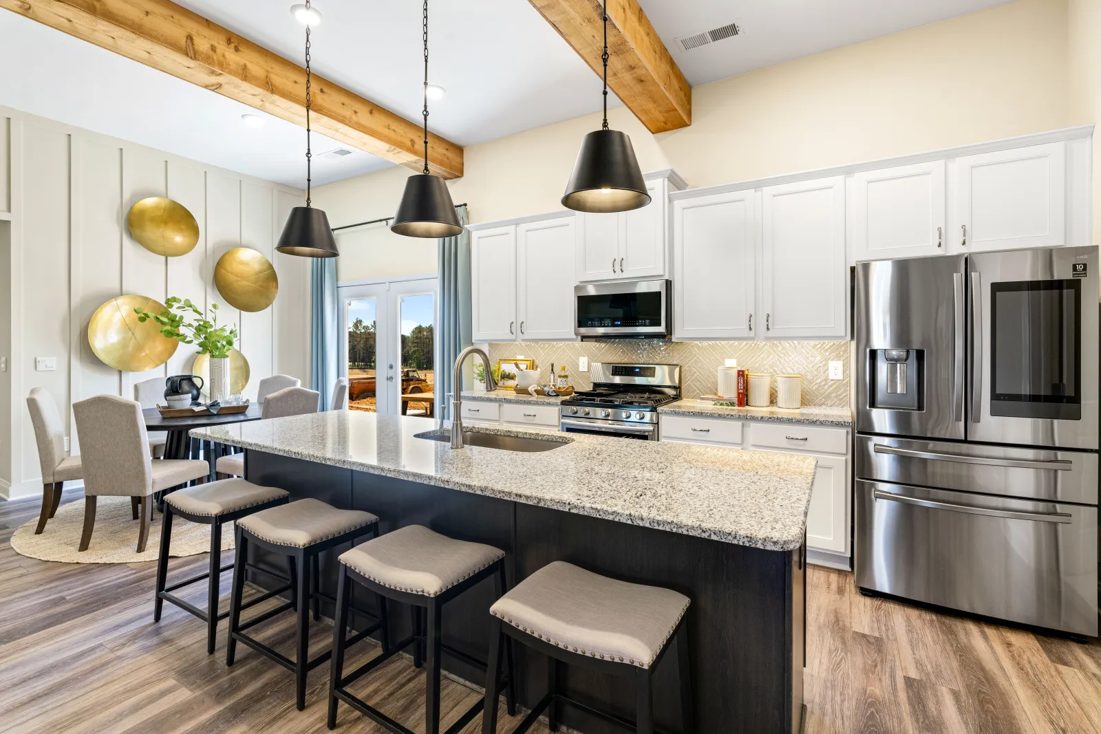 a kitchen with a bar stool and a bar stool