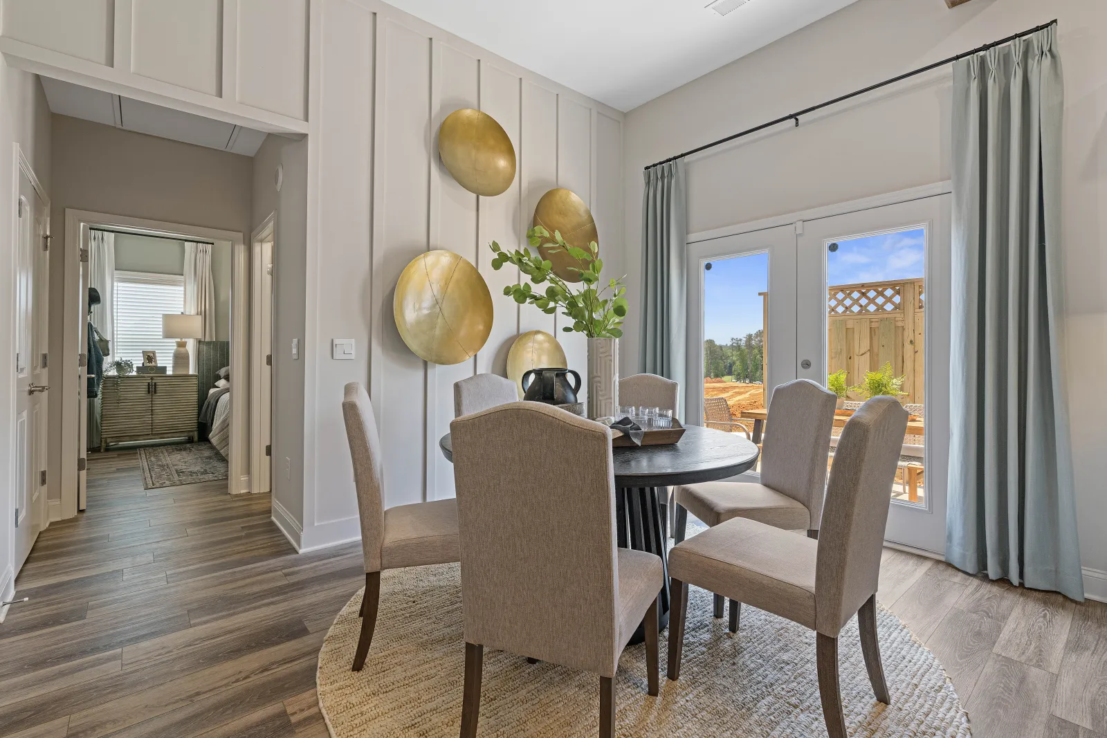 a dining room with a table and chairs