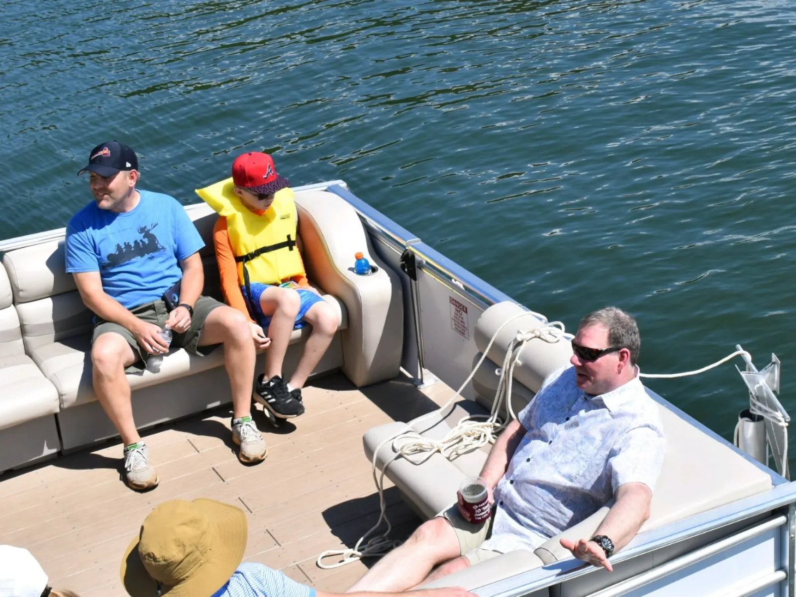 a group of people sitting on a boat