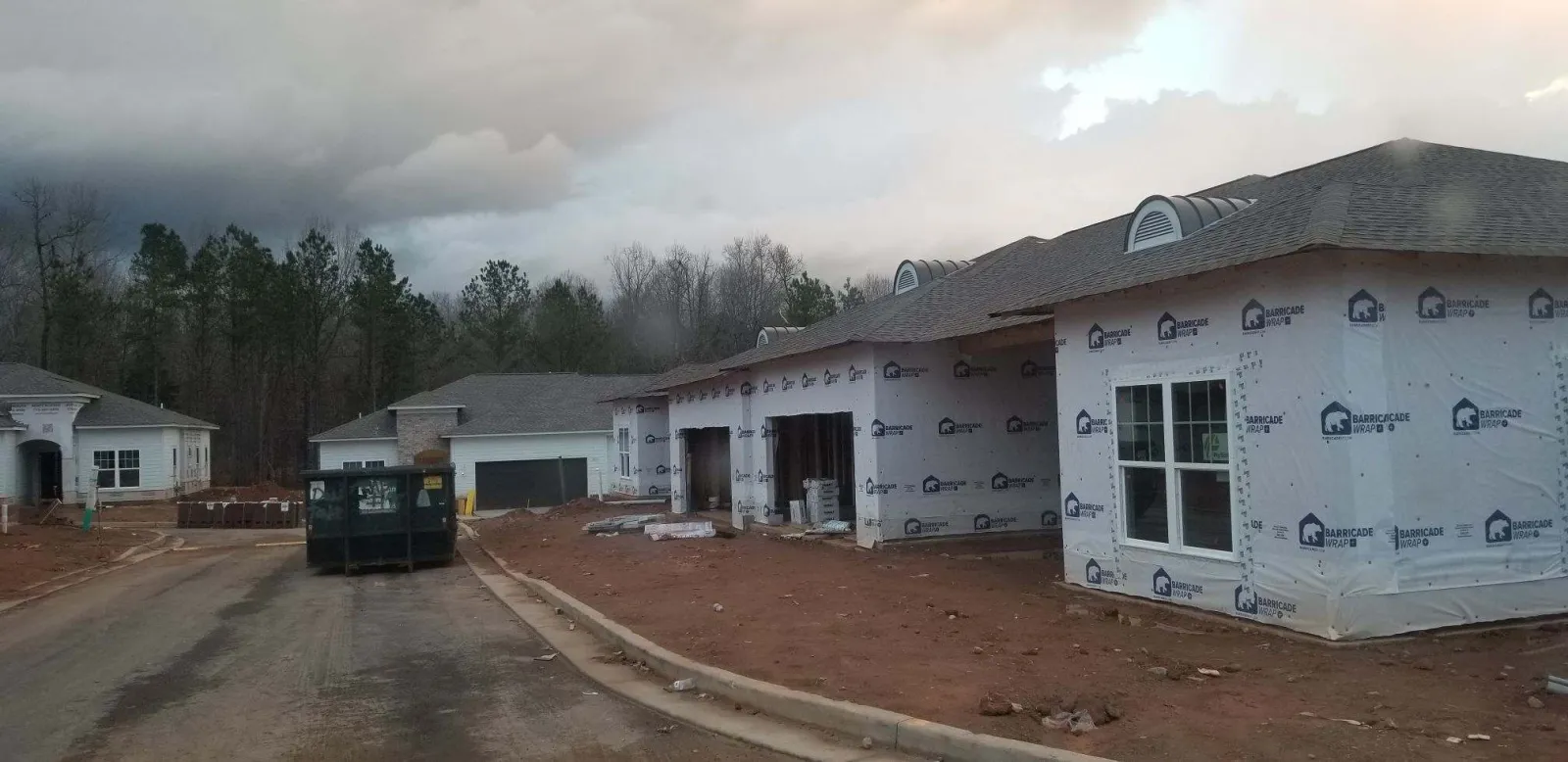 a building with a dirt road