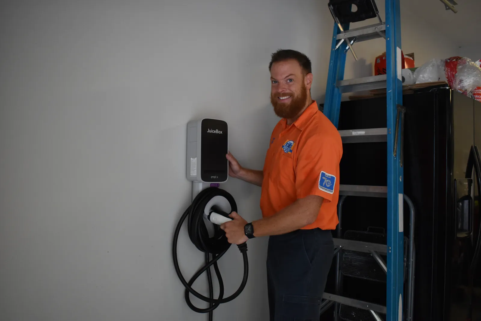 Britt, Estes Electrician installing a JuiceBox for an electrical Jeep 