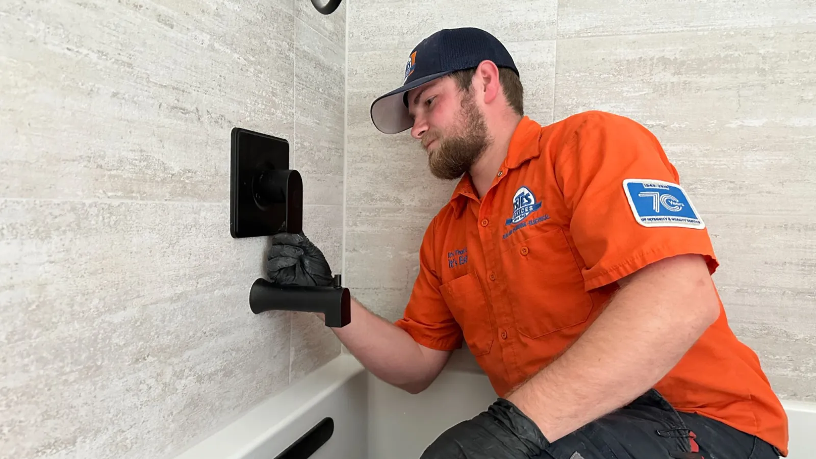 Estes Services Plumber installing a new plumbing fixture in Georgia
