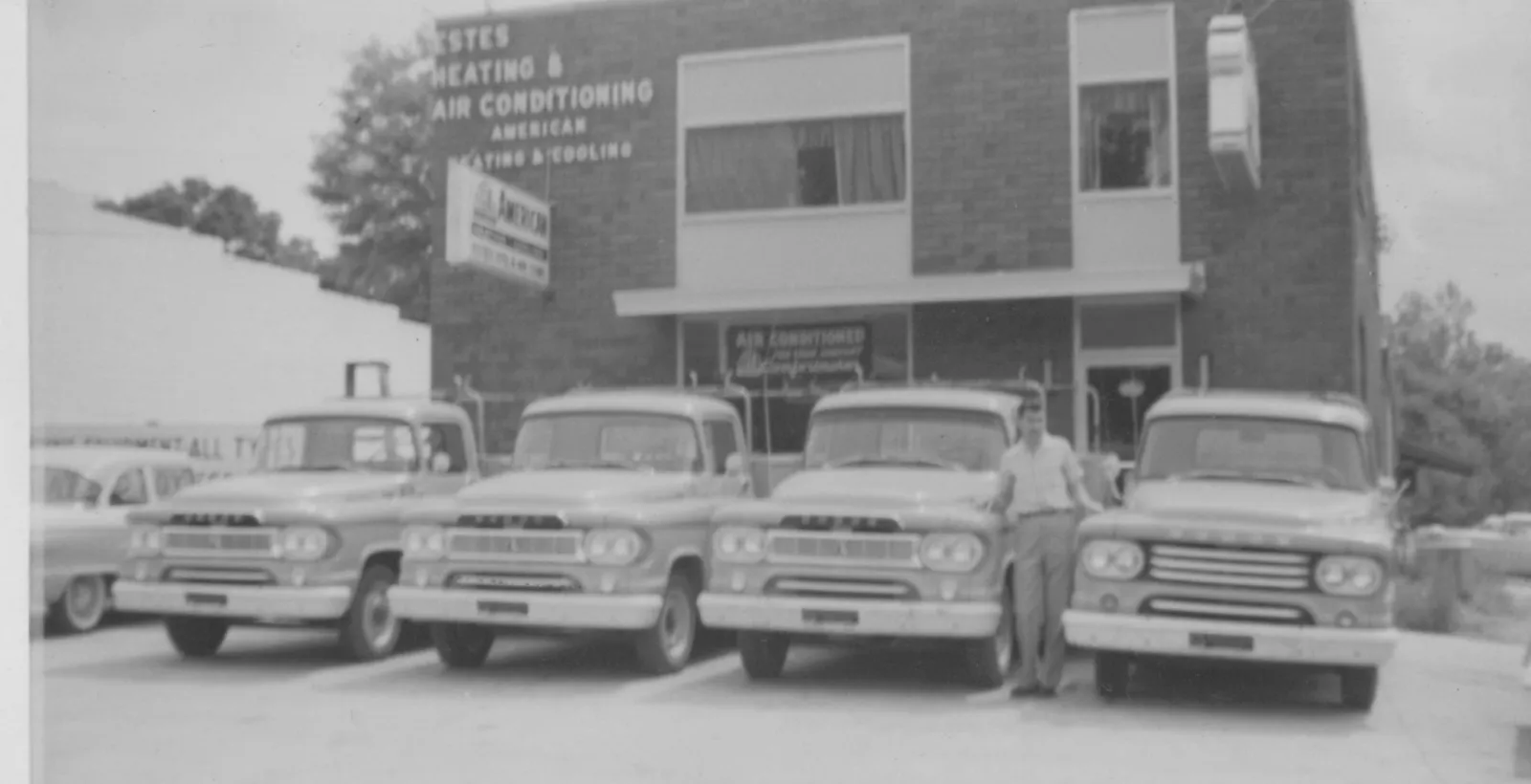Estes Services Founder, Nap Estes with HVAC Trucks