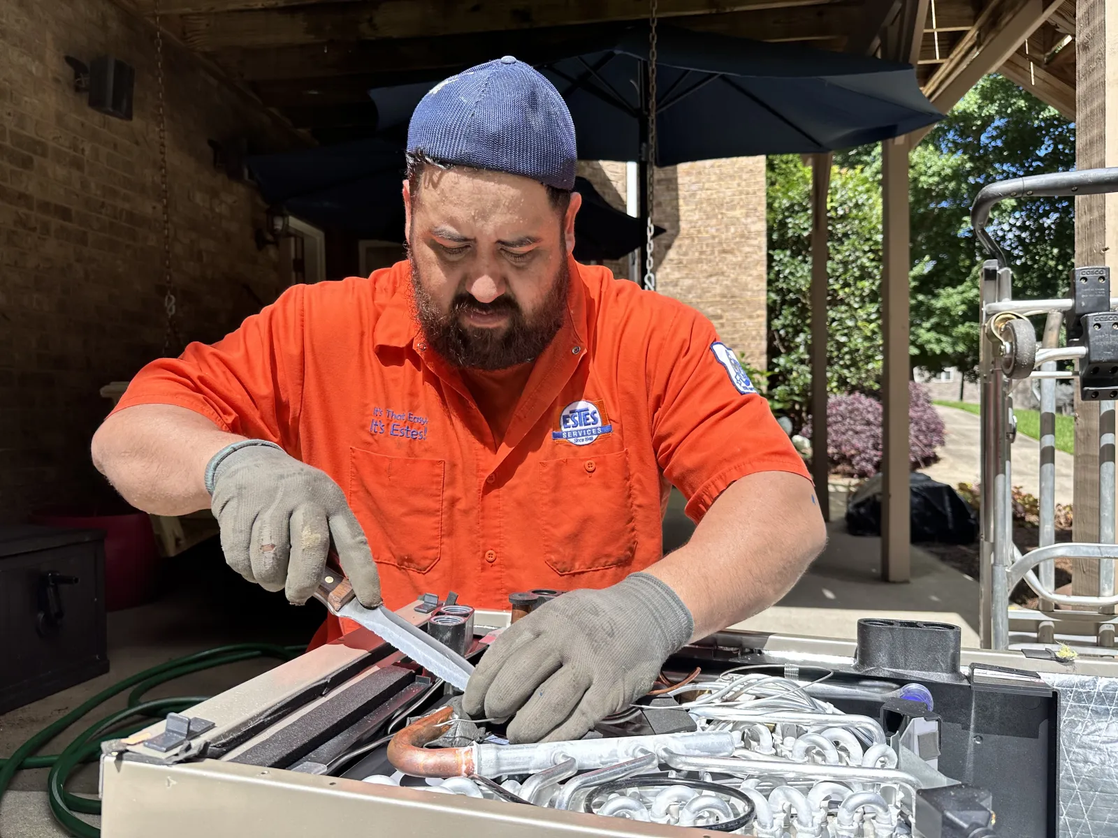 Estes Technician installing a Heat Pump thanks to the Georgia HEAR program in Metro Atlanta Area