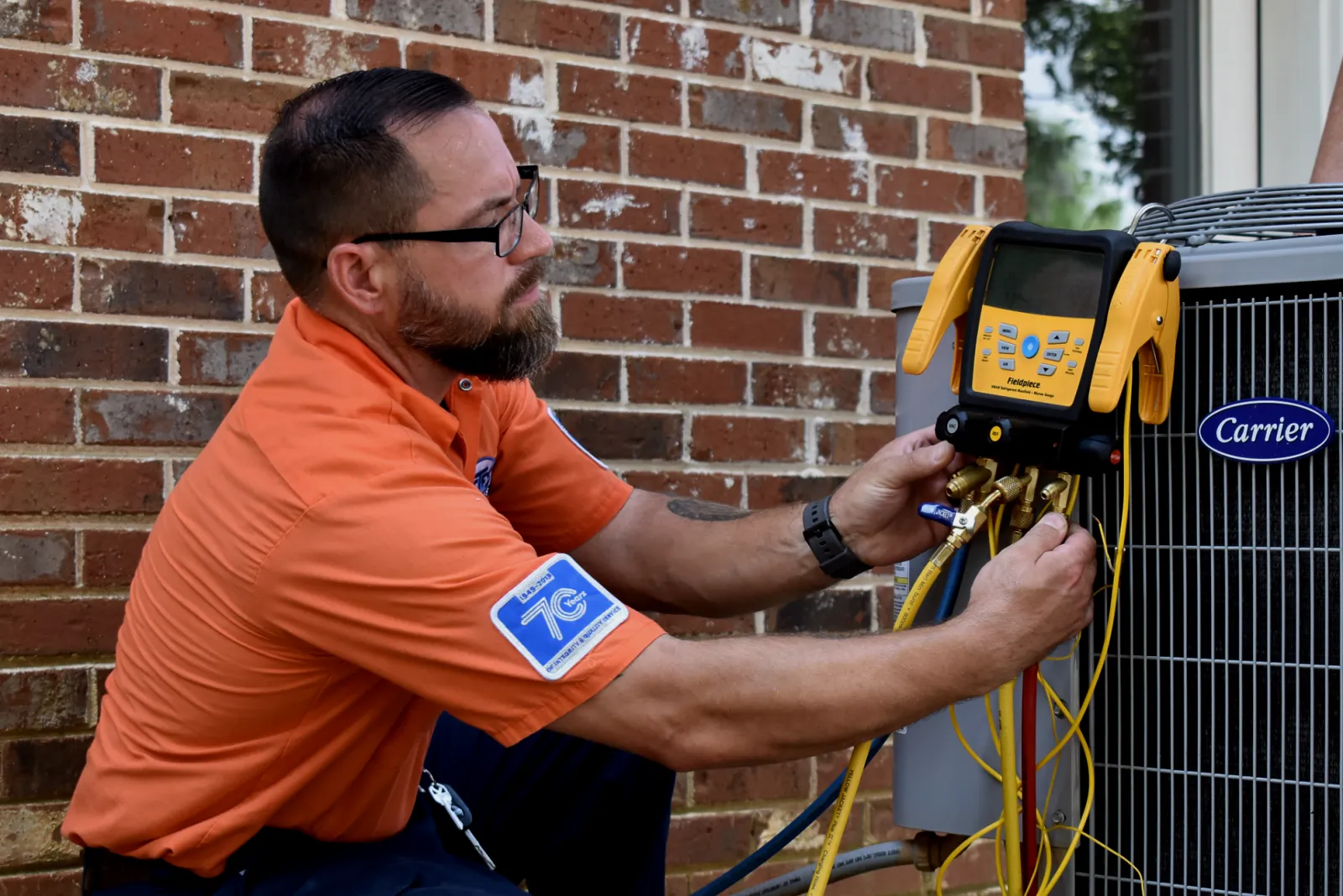 Atlanta technician repairing AC unit making weird noises