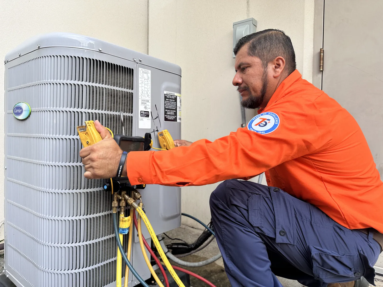 Estes Services technician installing a Heat Pump from the Georgia HEAR Program