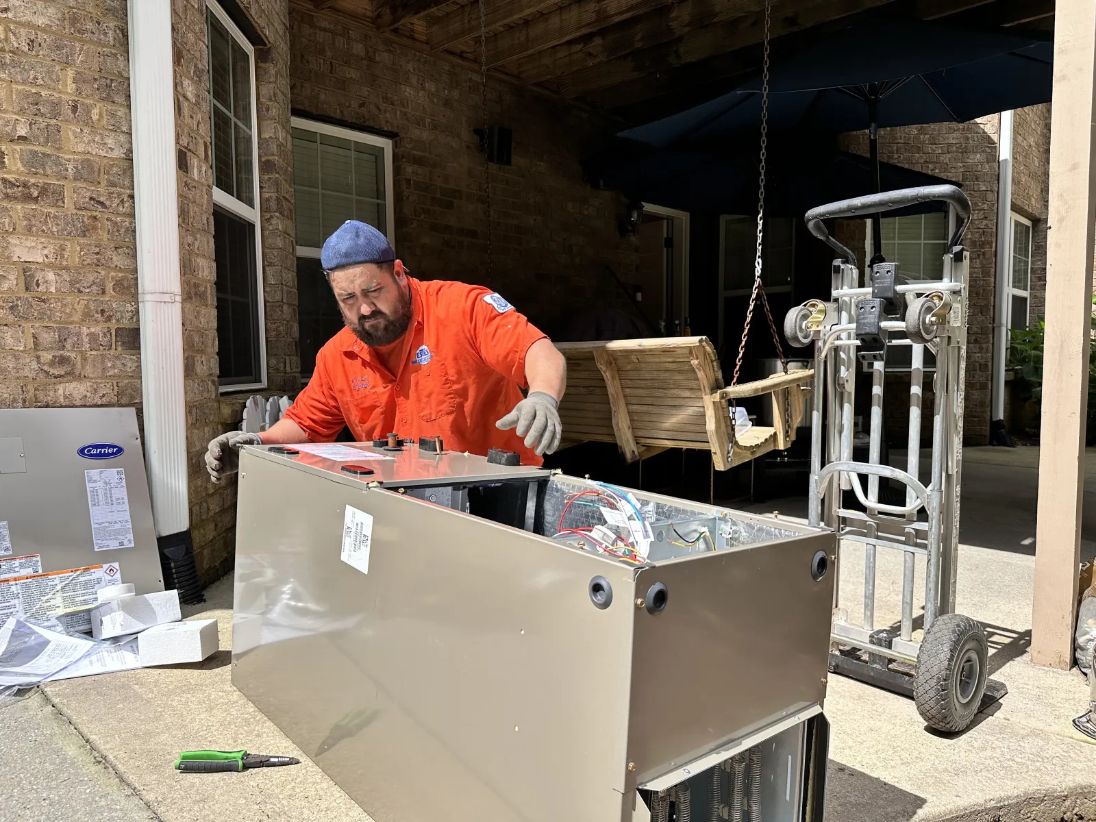 Estes Services Installer installing a Split HVAC Carrier System in Atlanta, Georgia
