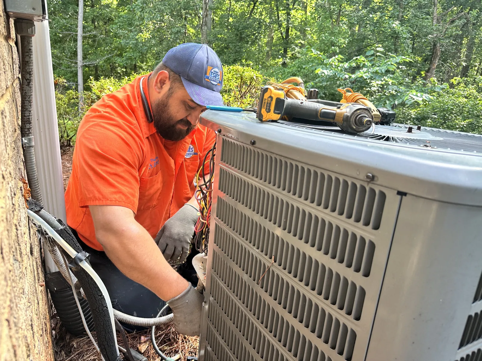 Estes Services Installer installing a Split HVAC Carrier System in Atlanta