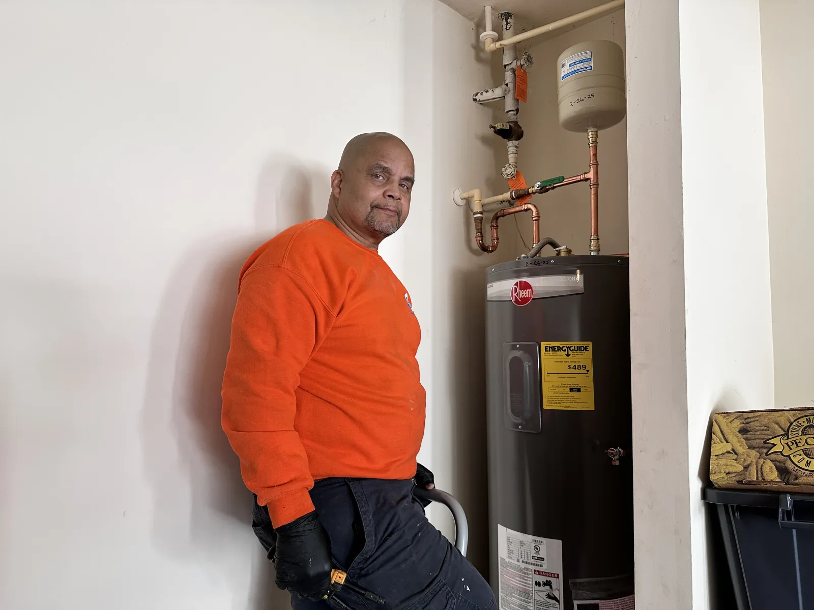 Estes Plumber installing a Tank Water Heater in Alpharetta, Georgia