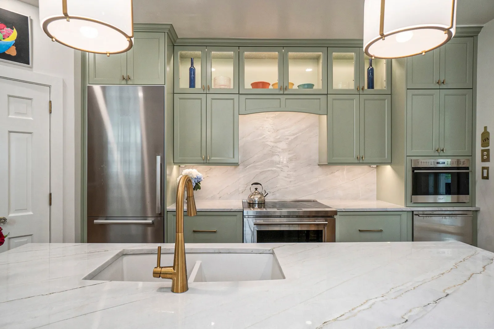 a kitchen with a stainless steel sink