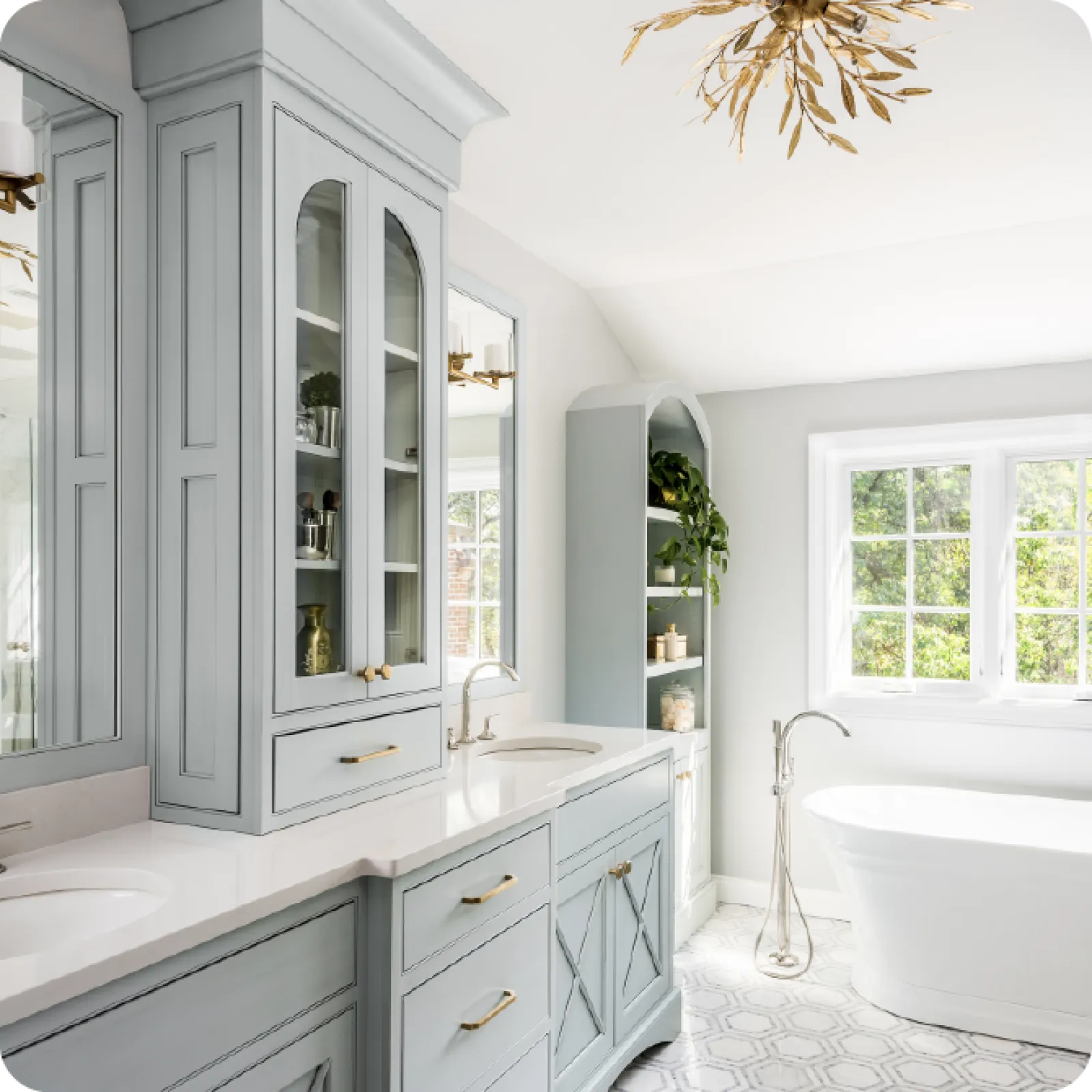 a bathroom with white cabinets