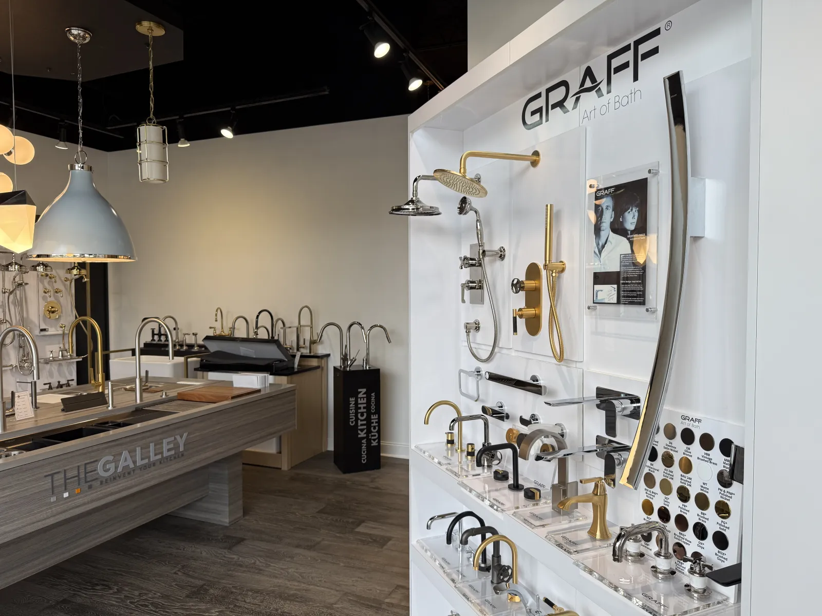 Modern bathroom and kitchen faucets and fixtures displayed in a showroom with branded Graff products.
