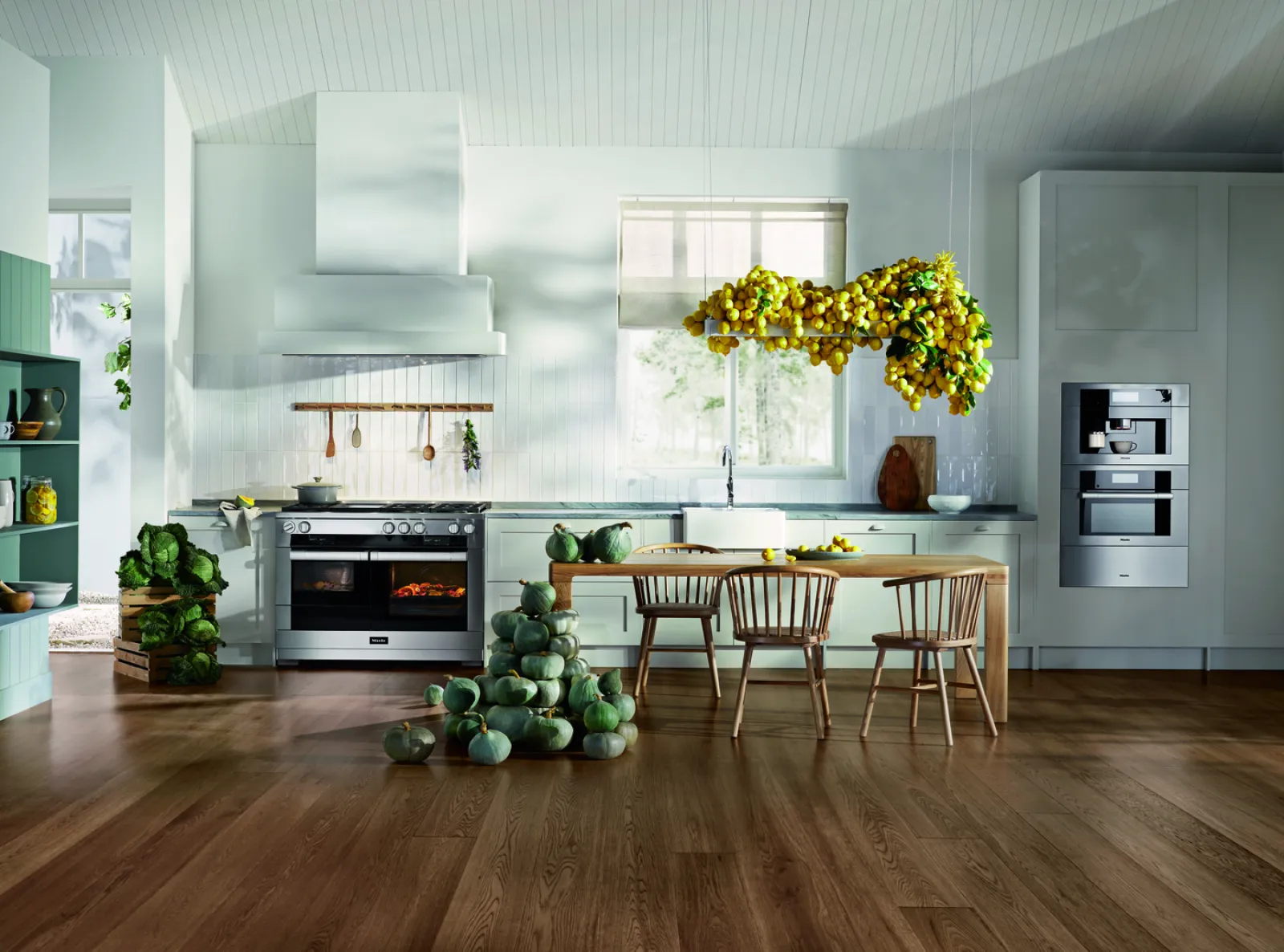 Bright and modern kitchen with lemon decor, wooden furniture, and green vegetables on the floor.