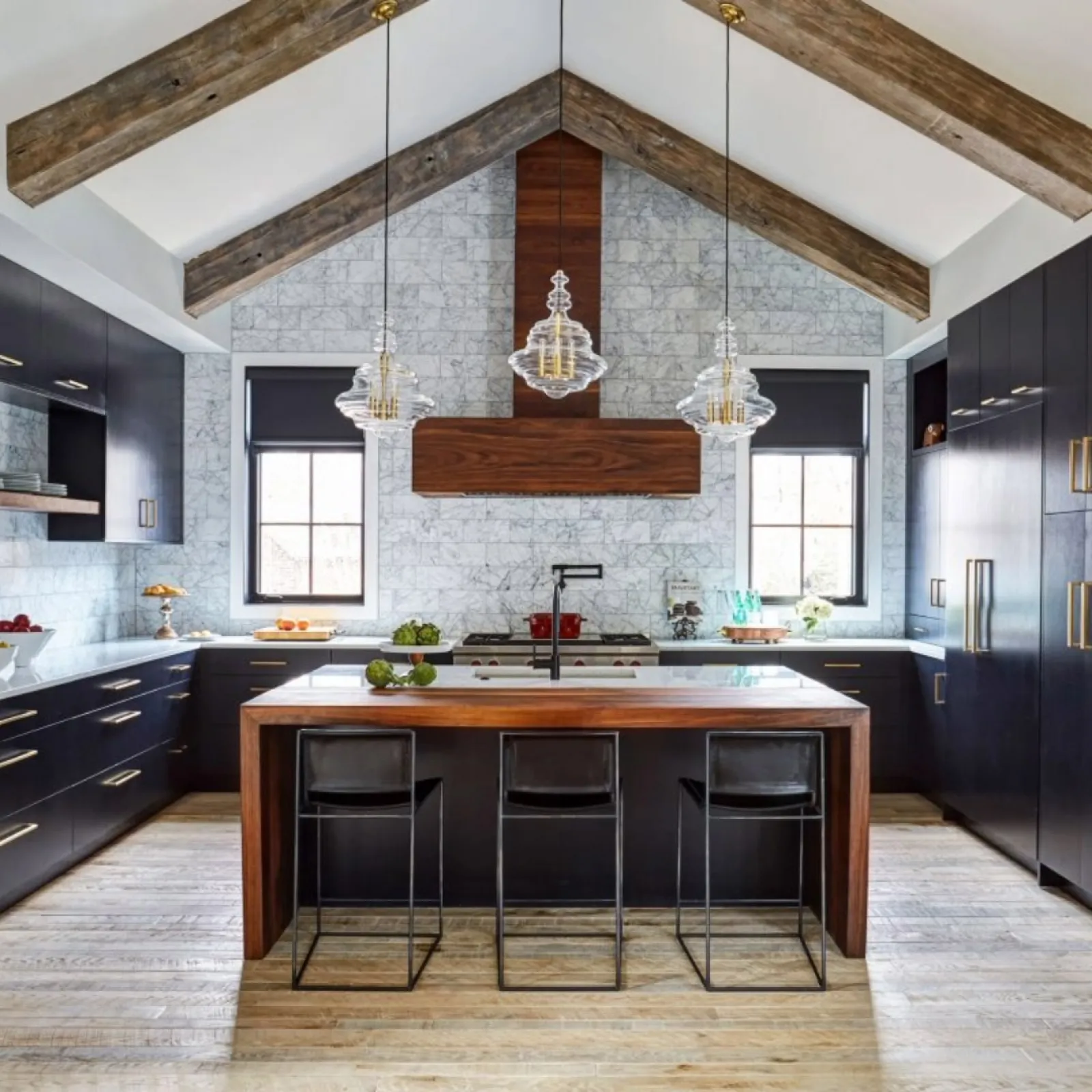 a kitchen with black cabinets