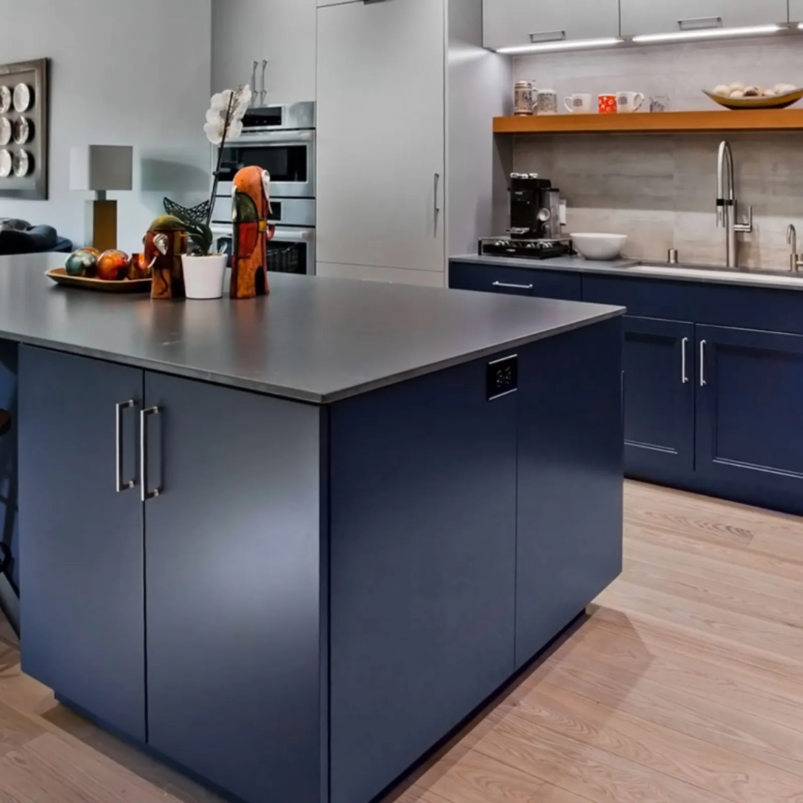 a kitchen with blue cabinets