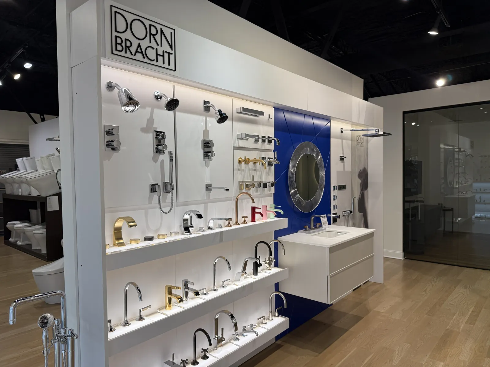 Showroom display of Dornbracht luxury faucet models and shower heads with modern bathroom fixtures.