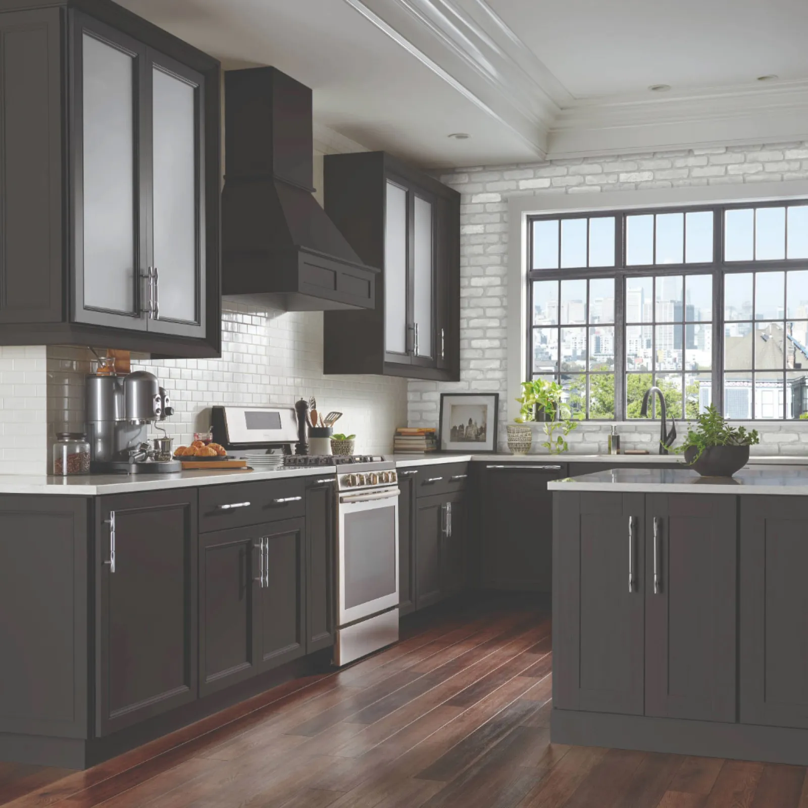 a kitchen with black cabinets