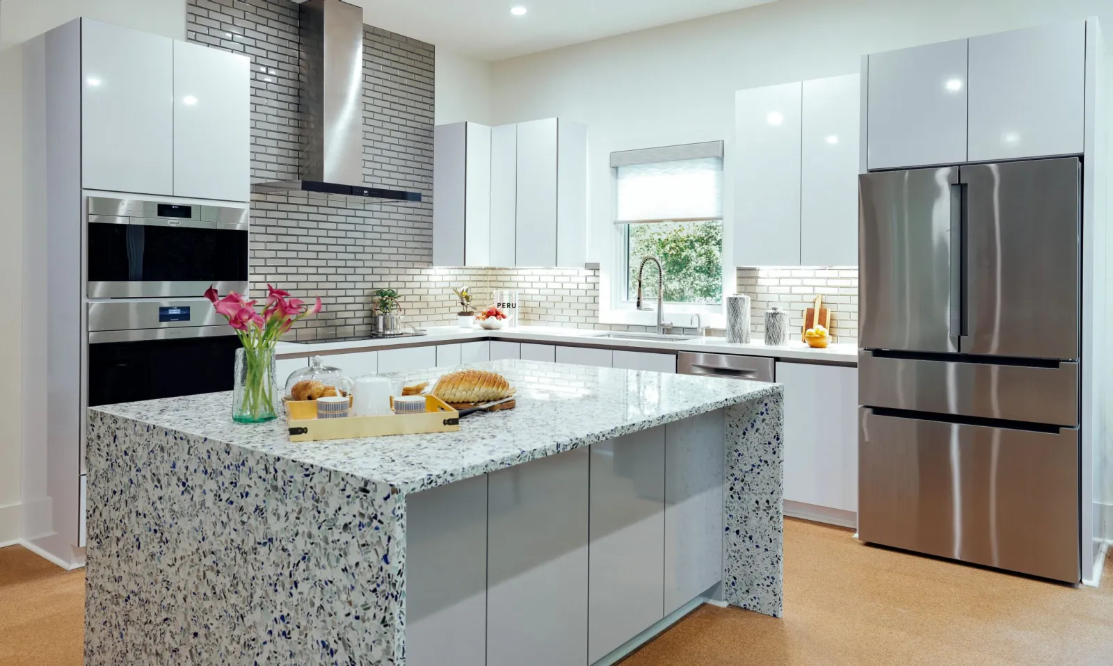 a kitchen with marble counter tops