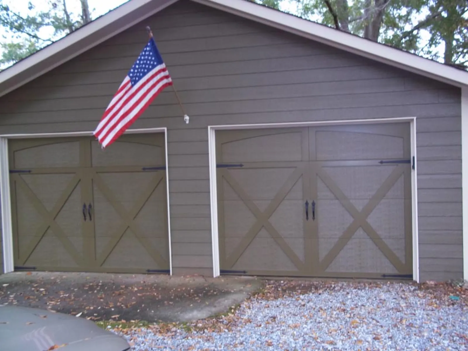 a garage door with a flag on top