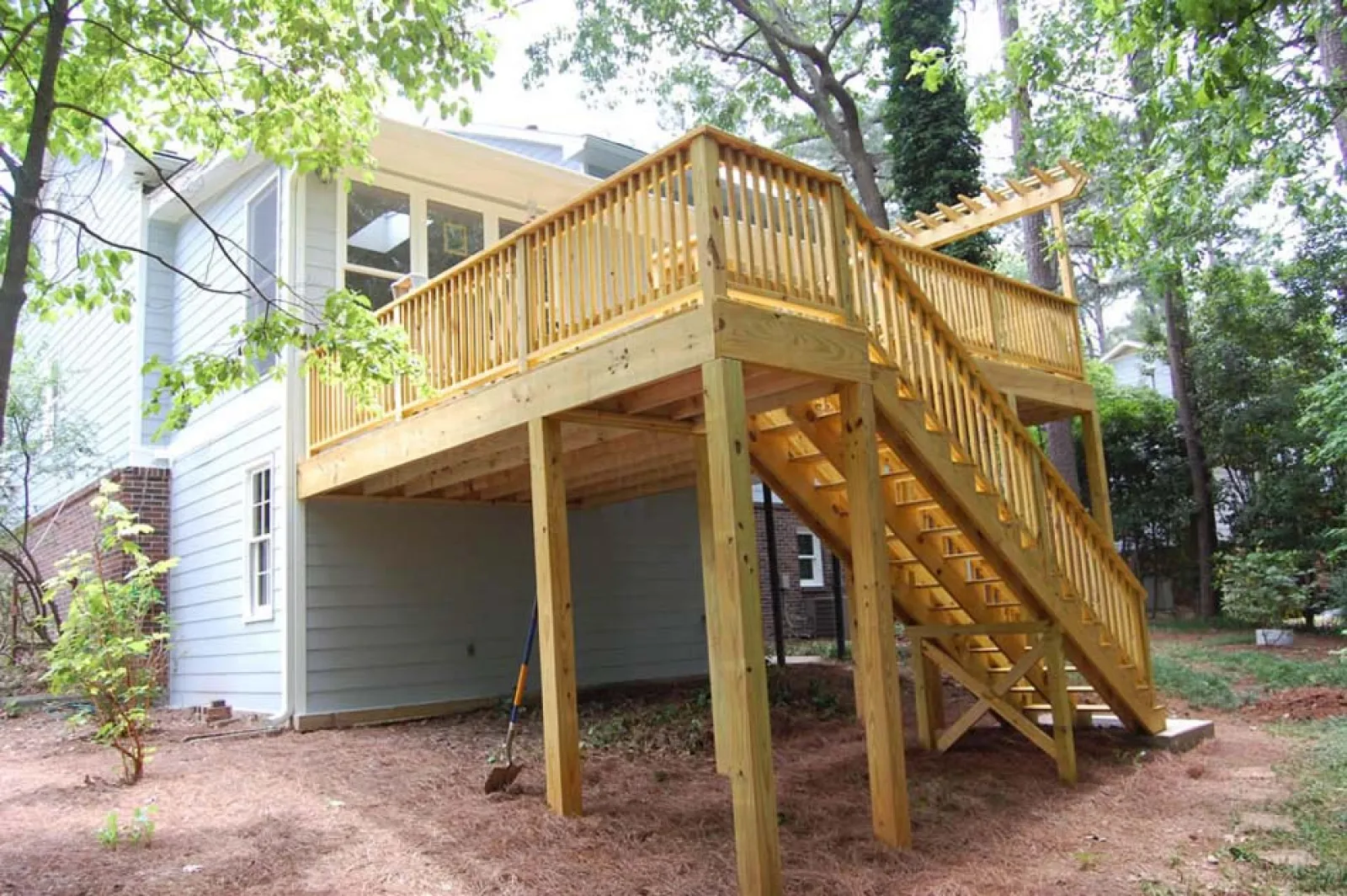 a wooden house with a deck