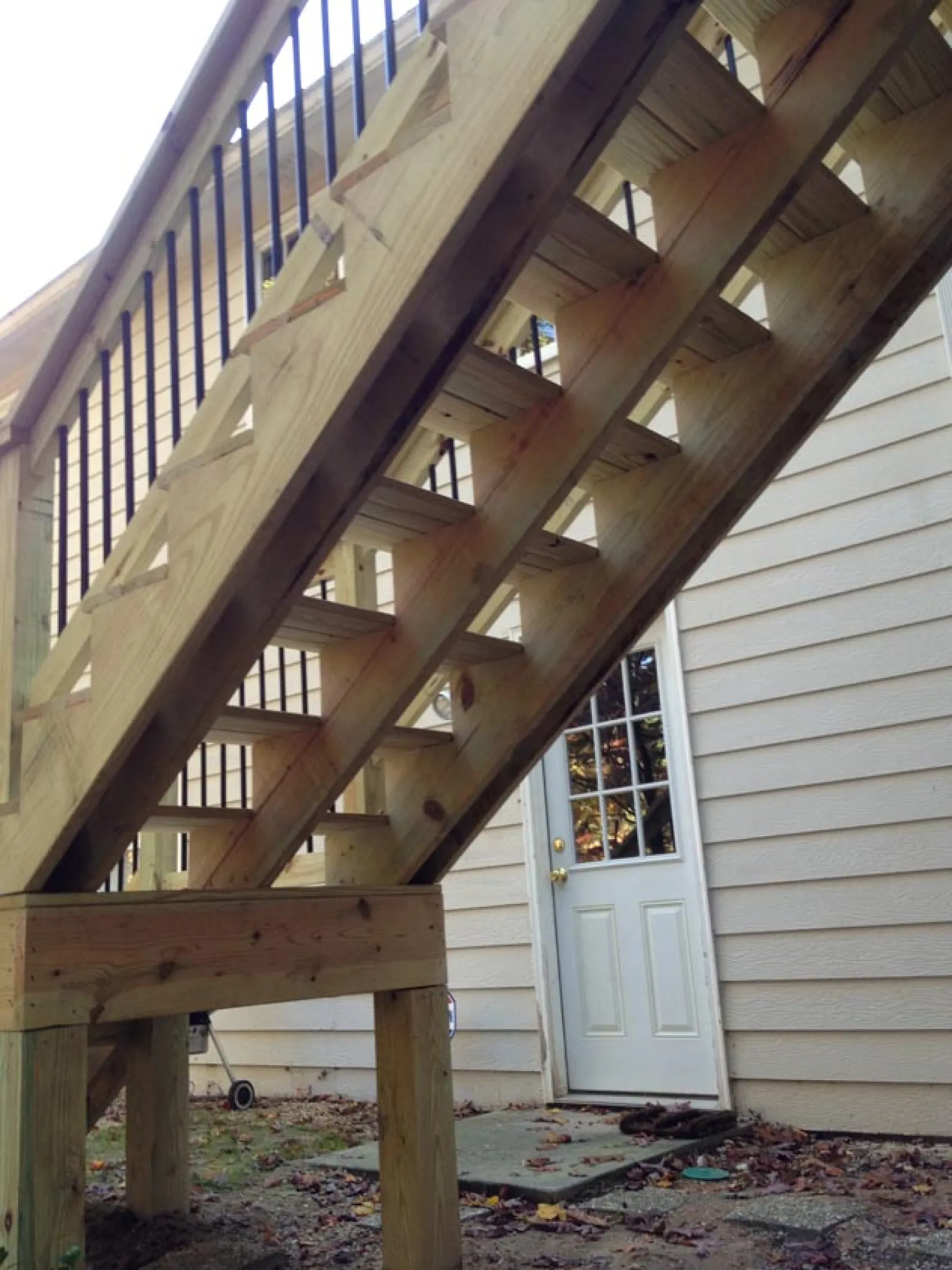a wooden staircase next to a house