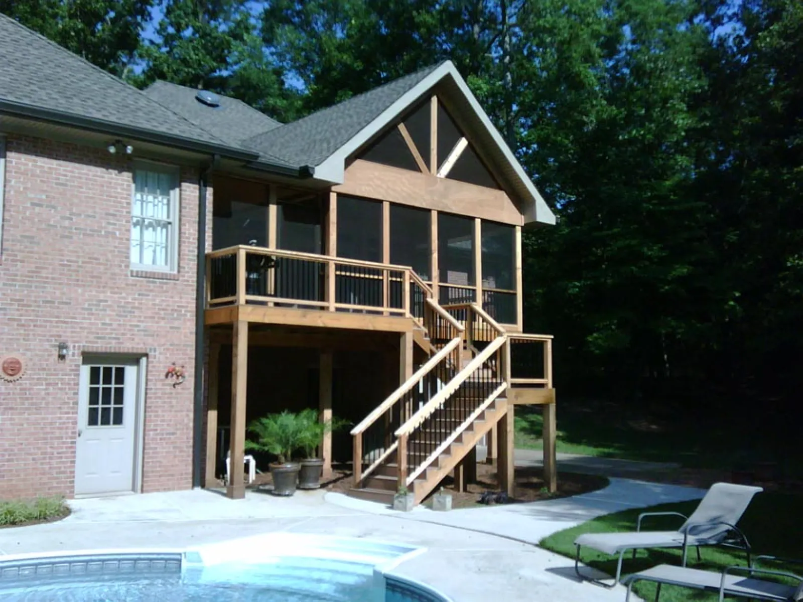 a house with a deck and a pool