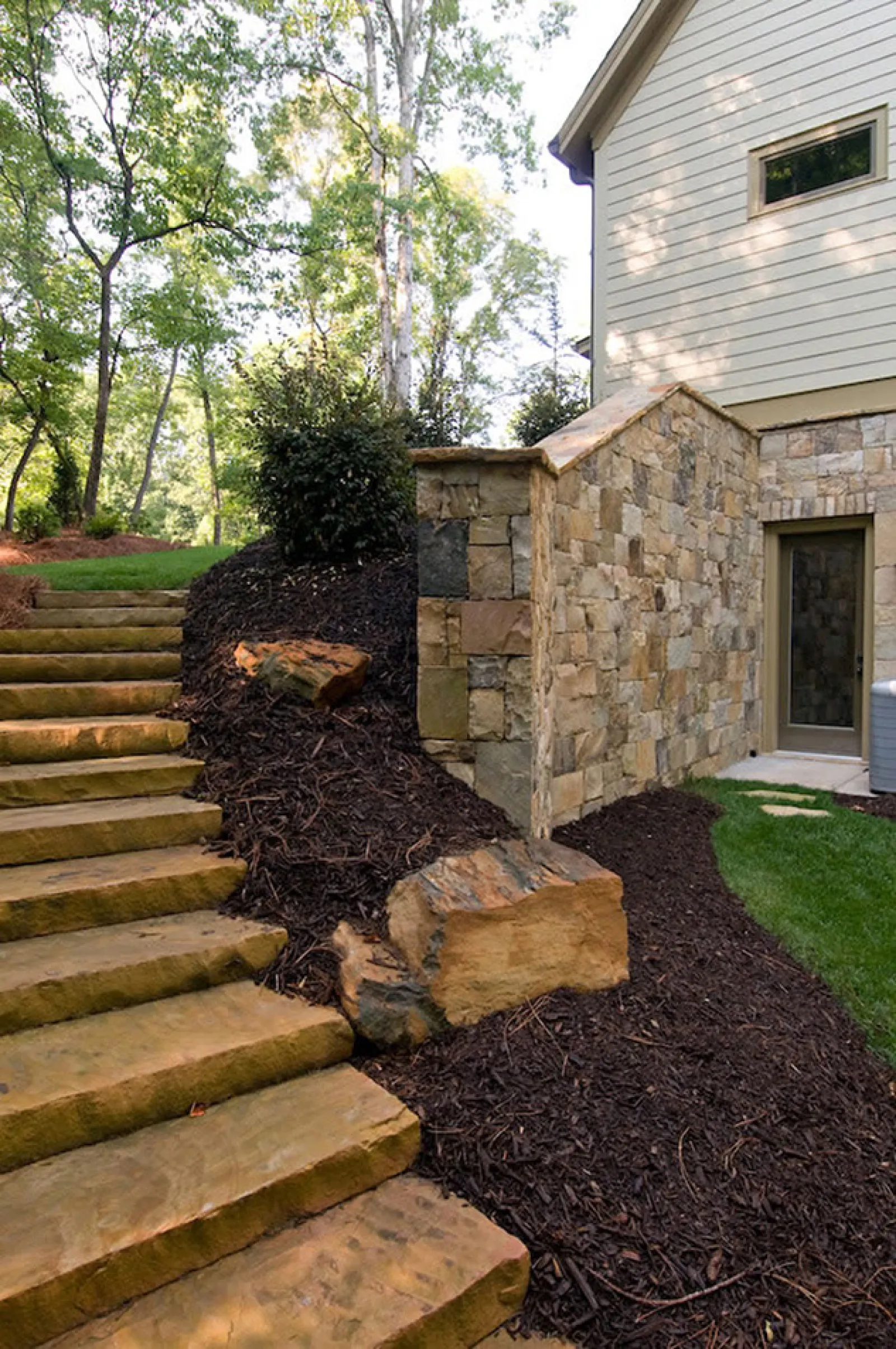 a stone staircase leading up to a house