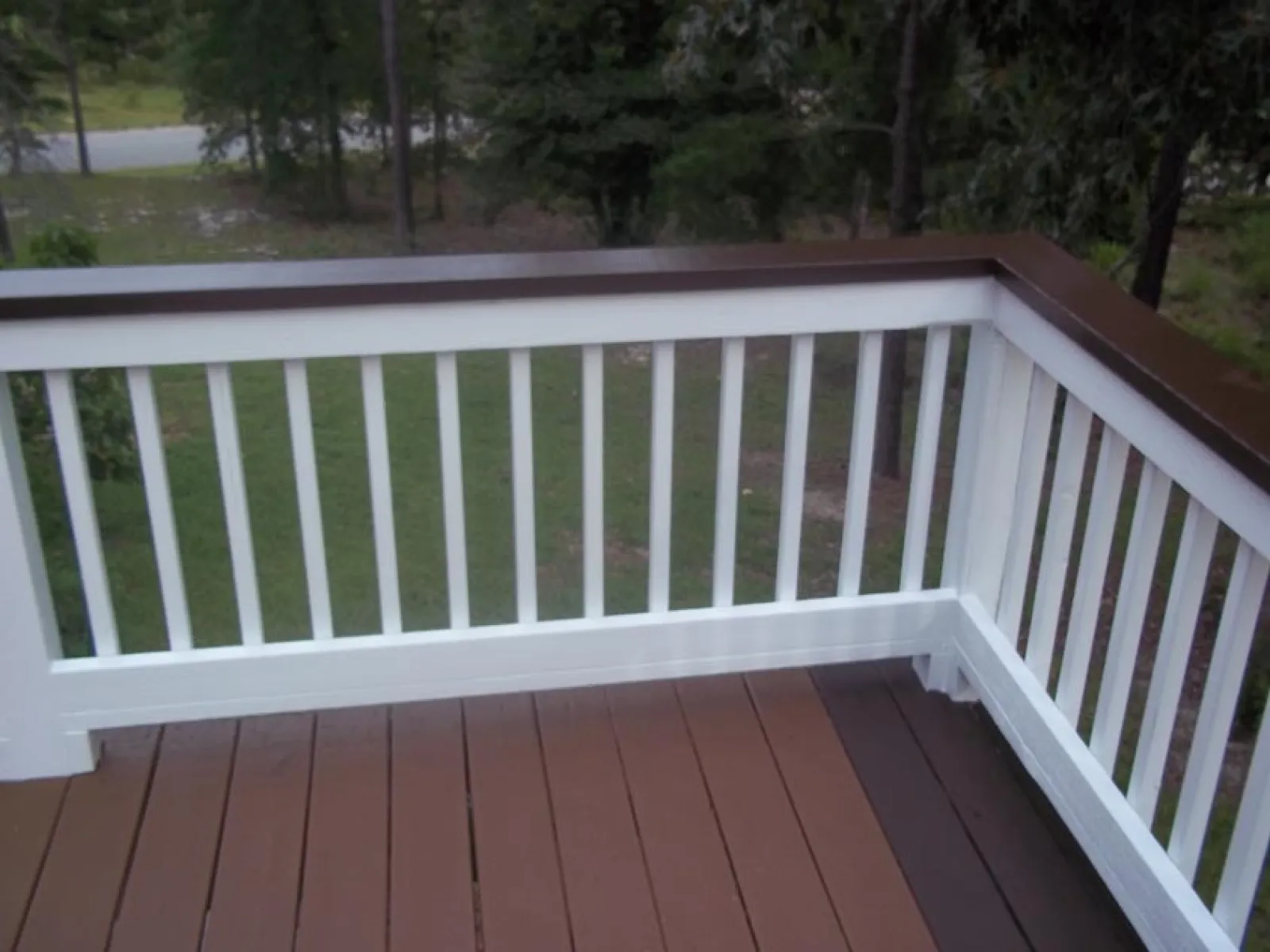 a white railing on a deck