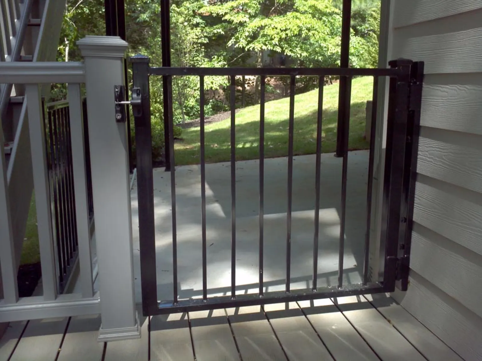 a glass door with a metal railing