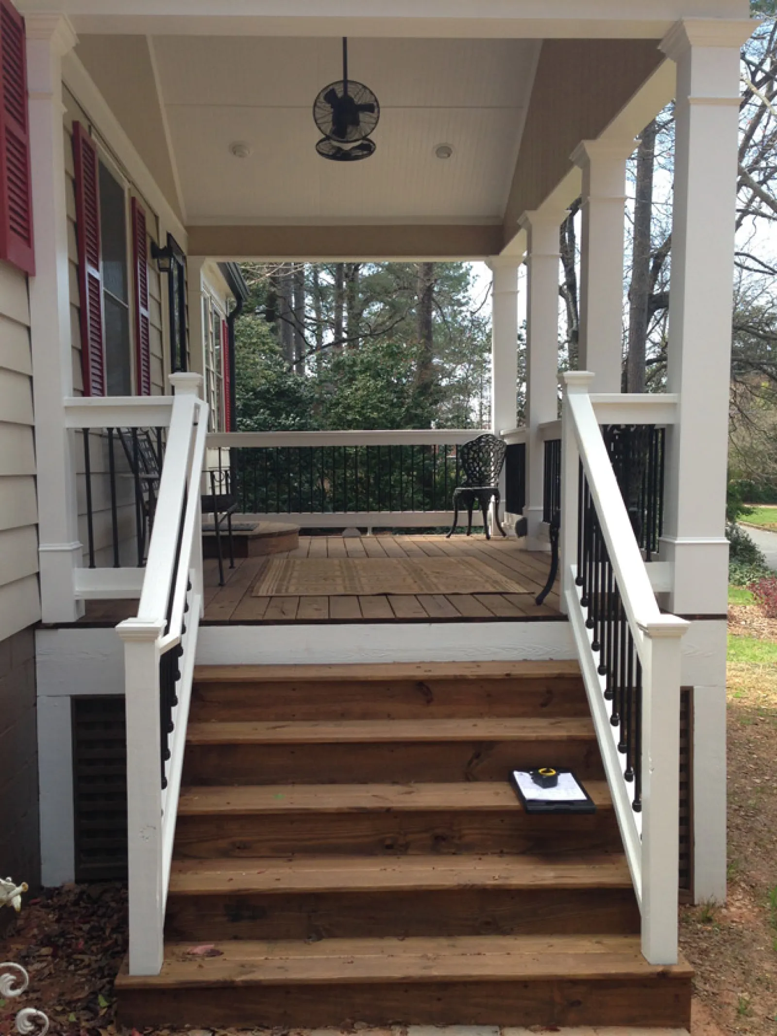 a wooden porch with a railing