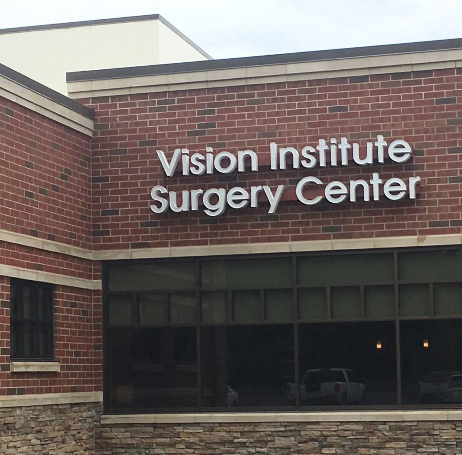 a brick building with a sign on it