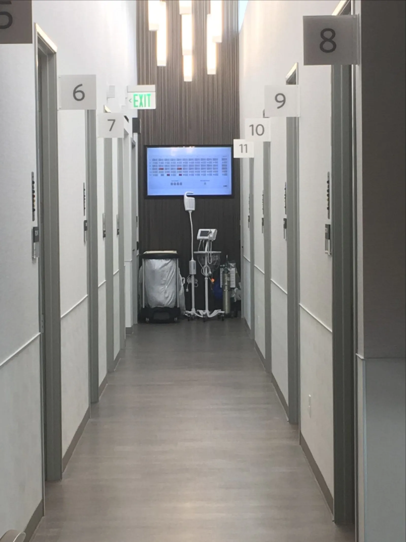 a hallway with a screen and lockers