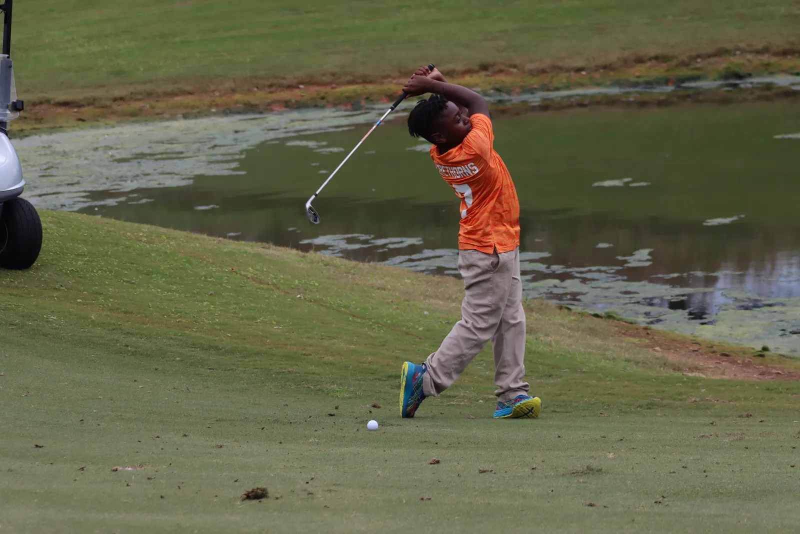 a man swinging a golf club