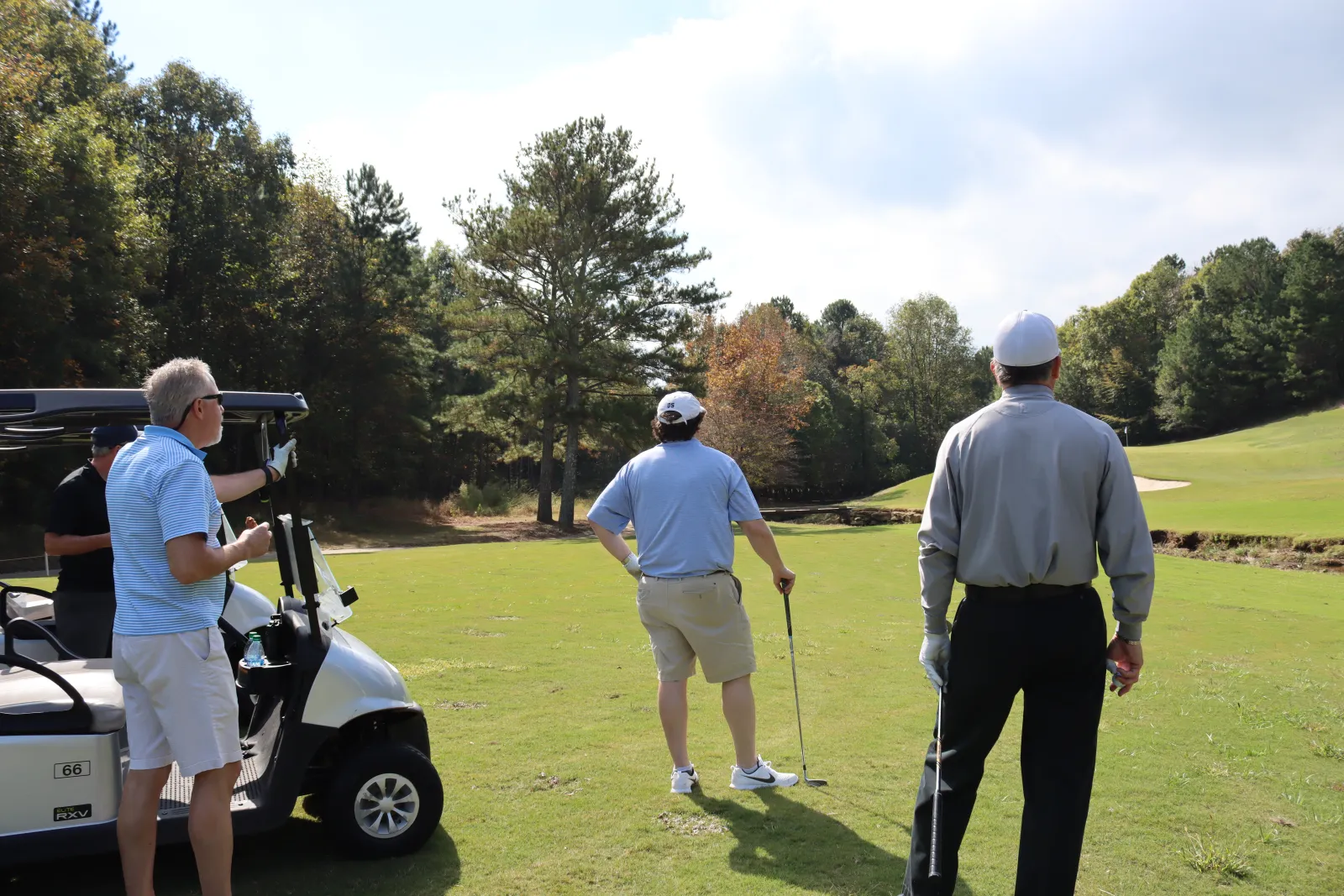 a group of men playing golf