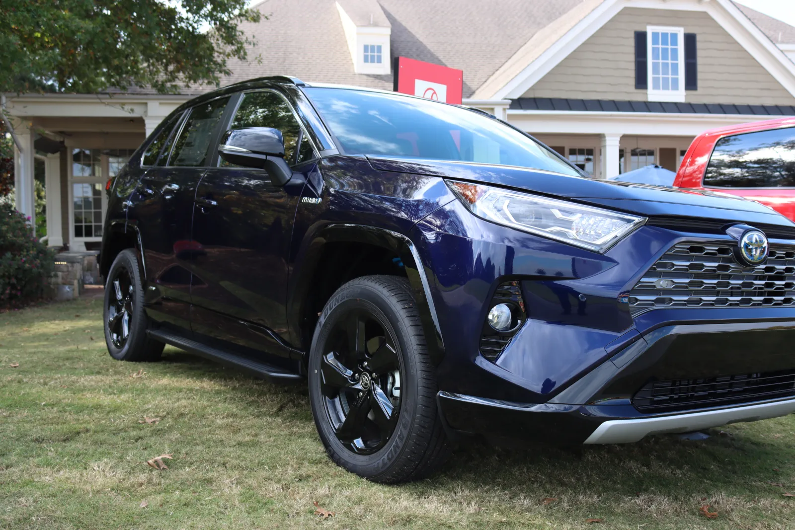 a black car parked in a yard