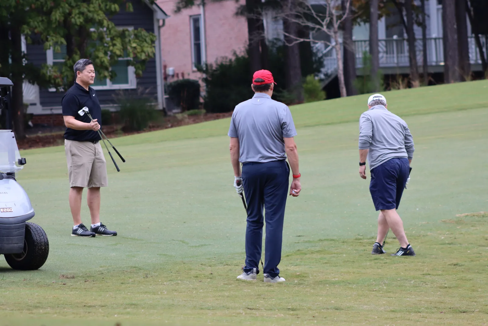 a group of men playing golf