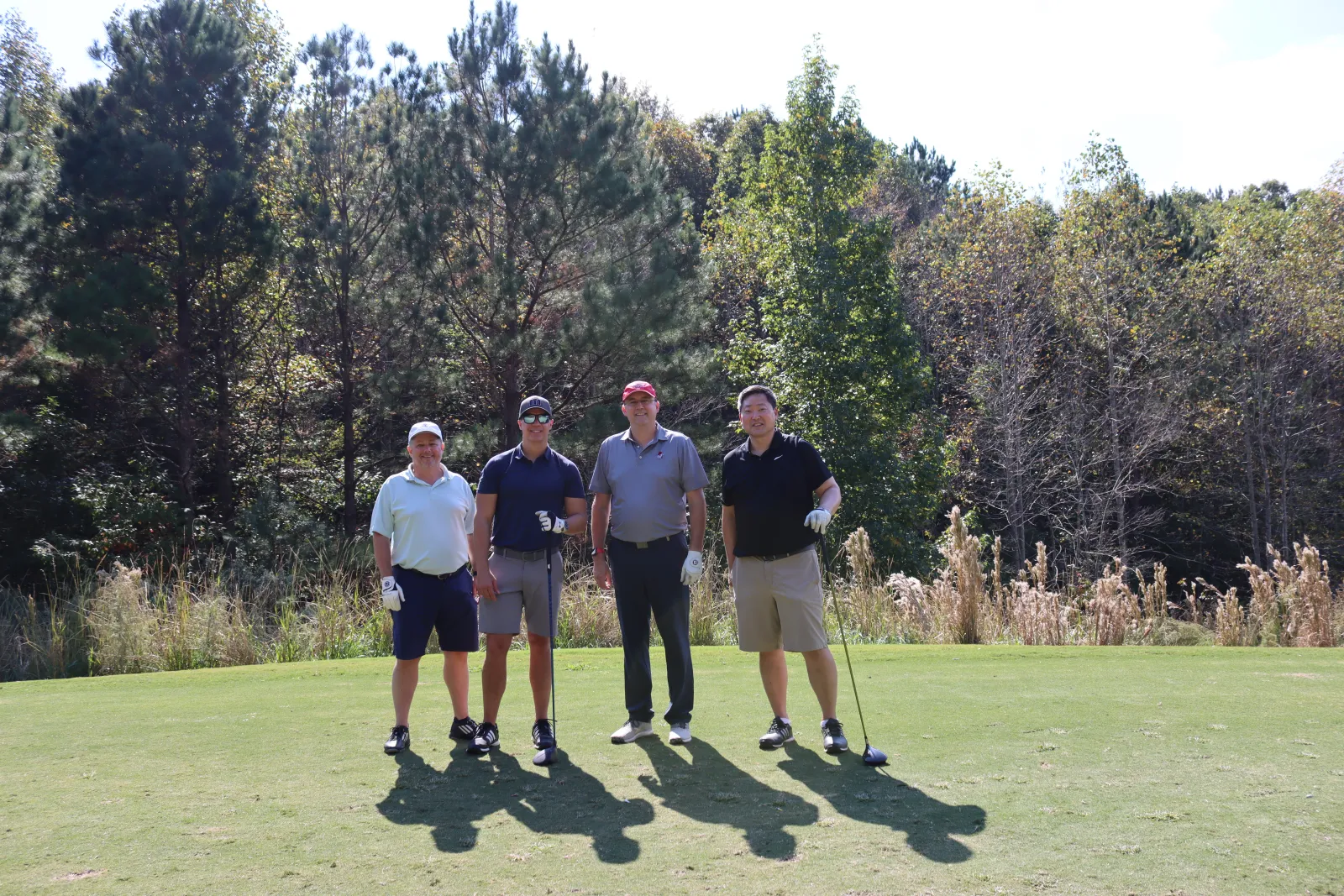 a group of men on a golf course