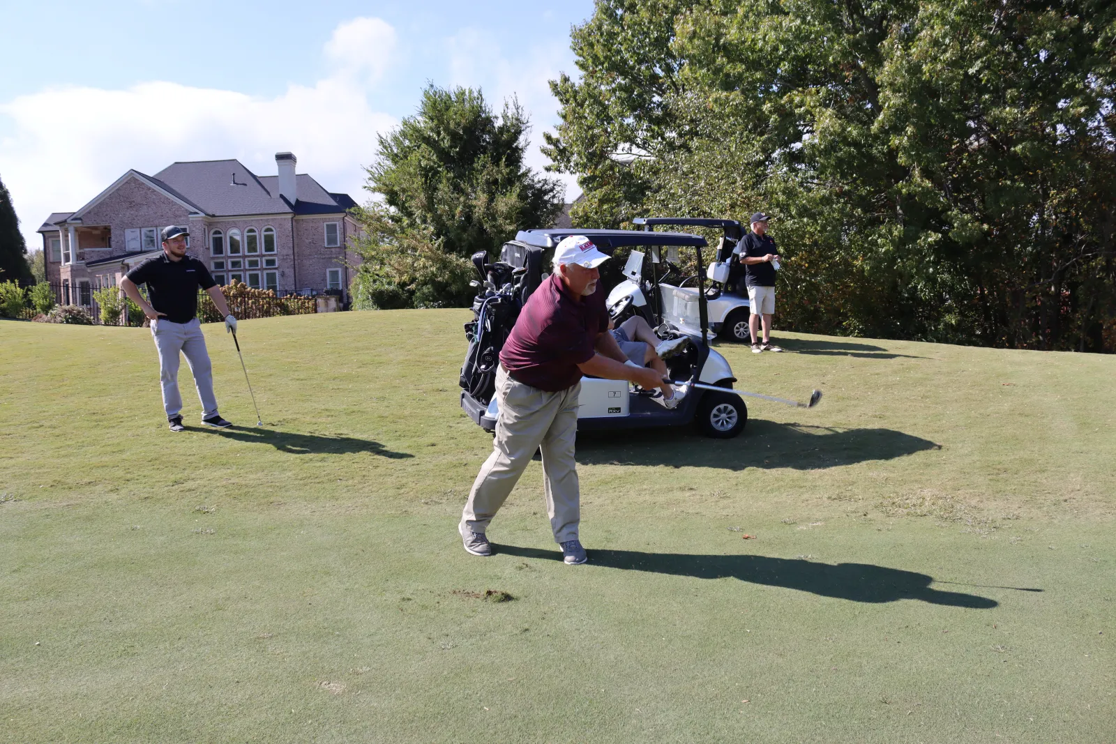 a group of people playing golf