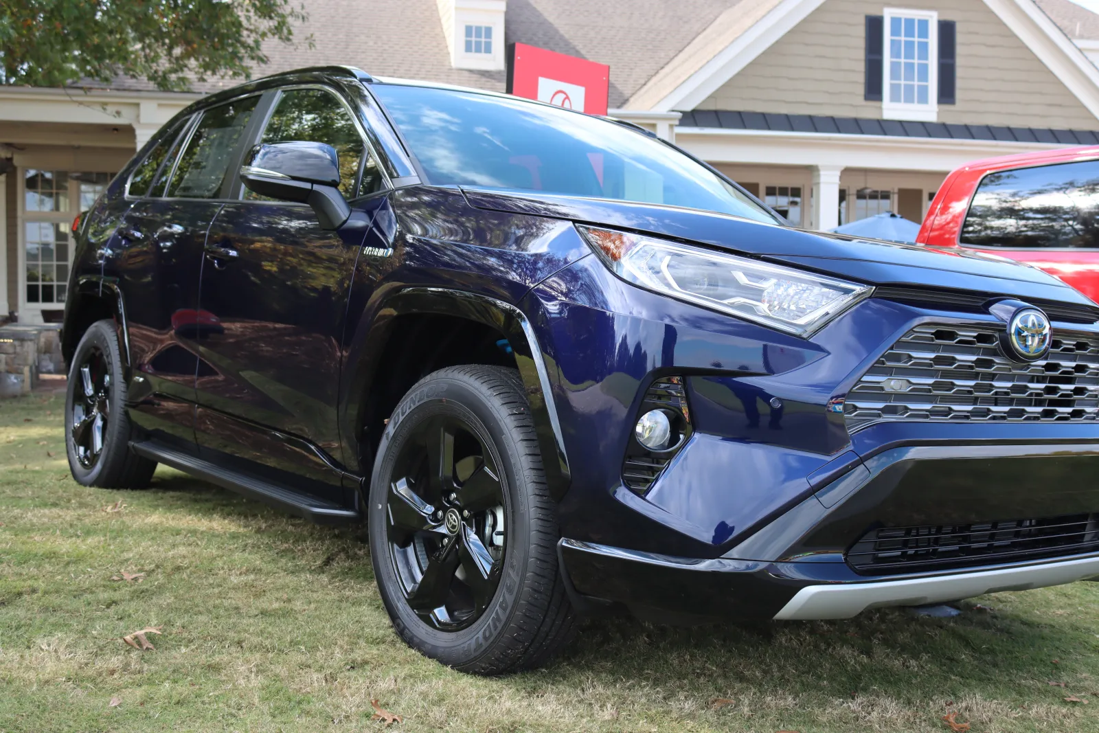 a black car parked on grass