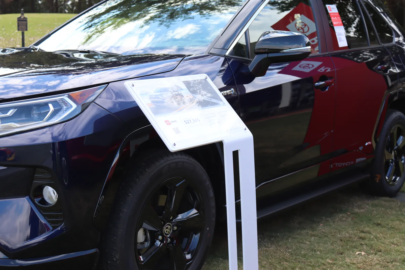 a car with a sign on the door